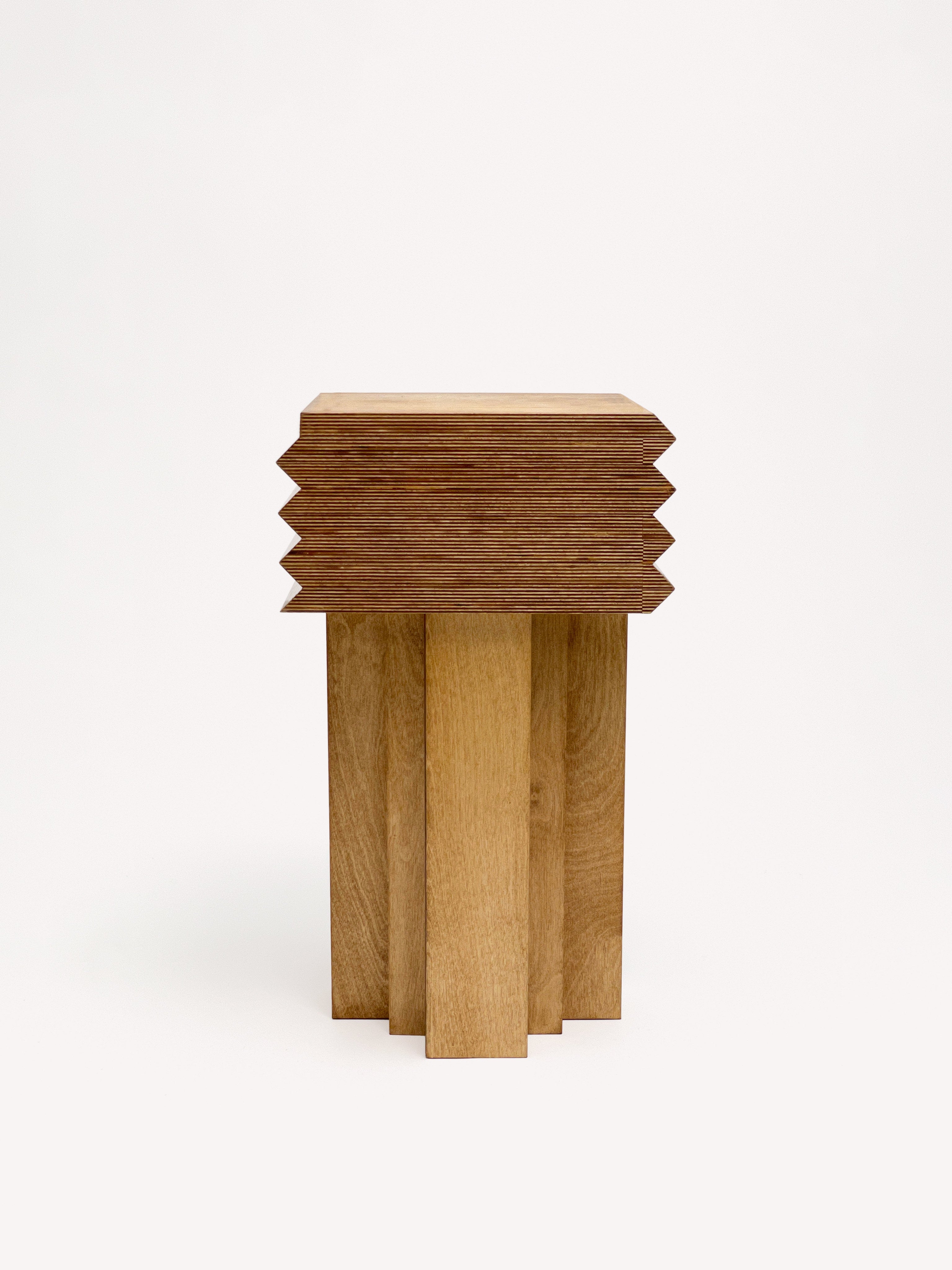 The MM Stool - Butterscotch by Goons from GOONS features a modern square stacked top with zigzag edges and four vertical rectangular legs, inspired by the classic MM Stool, shown against a plain white background.