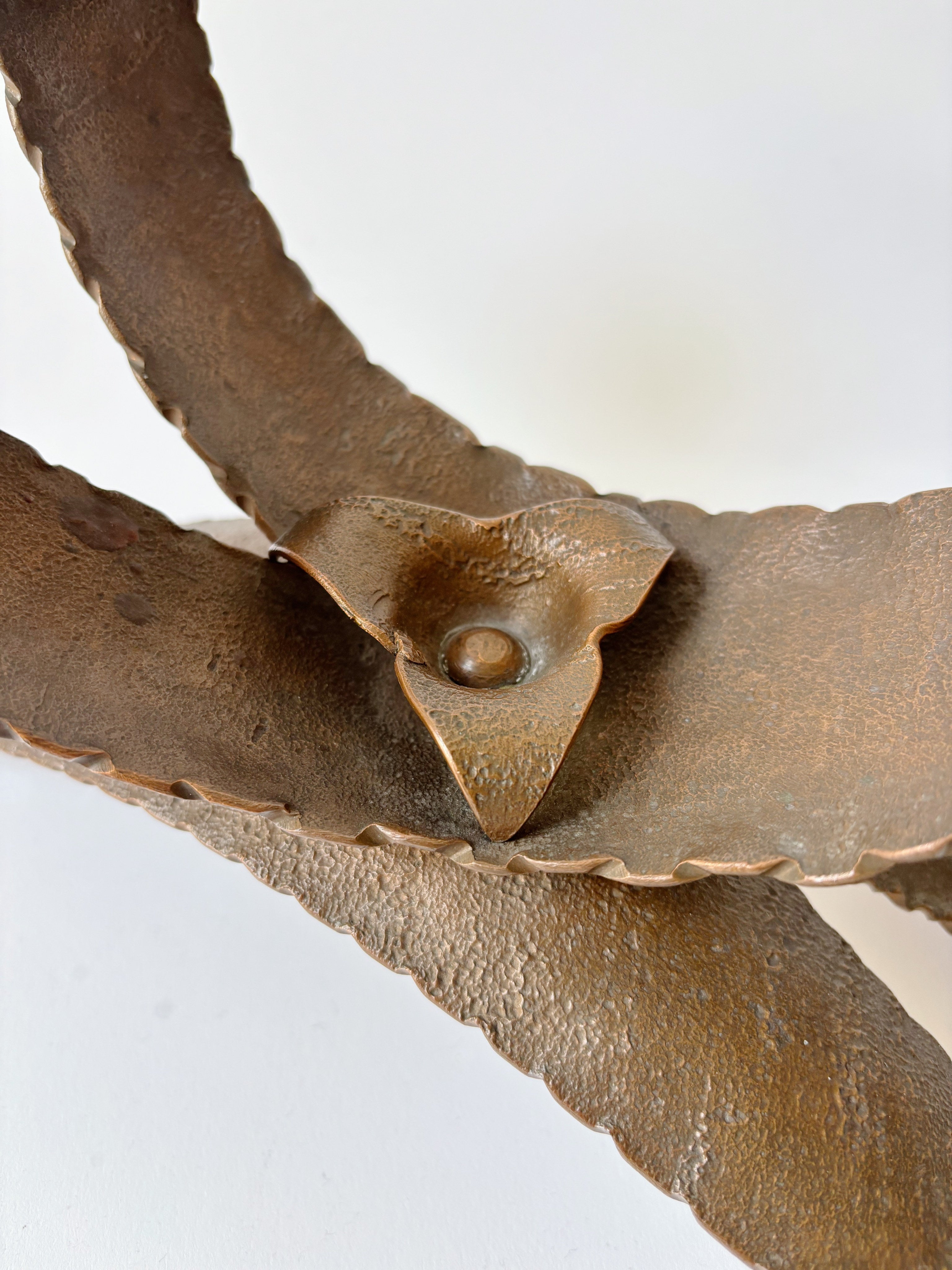 Large Metal Curved Artisan Candlestick, Poland — back view highlighting textured metal finish