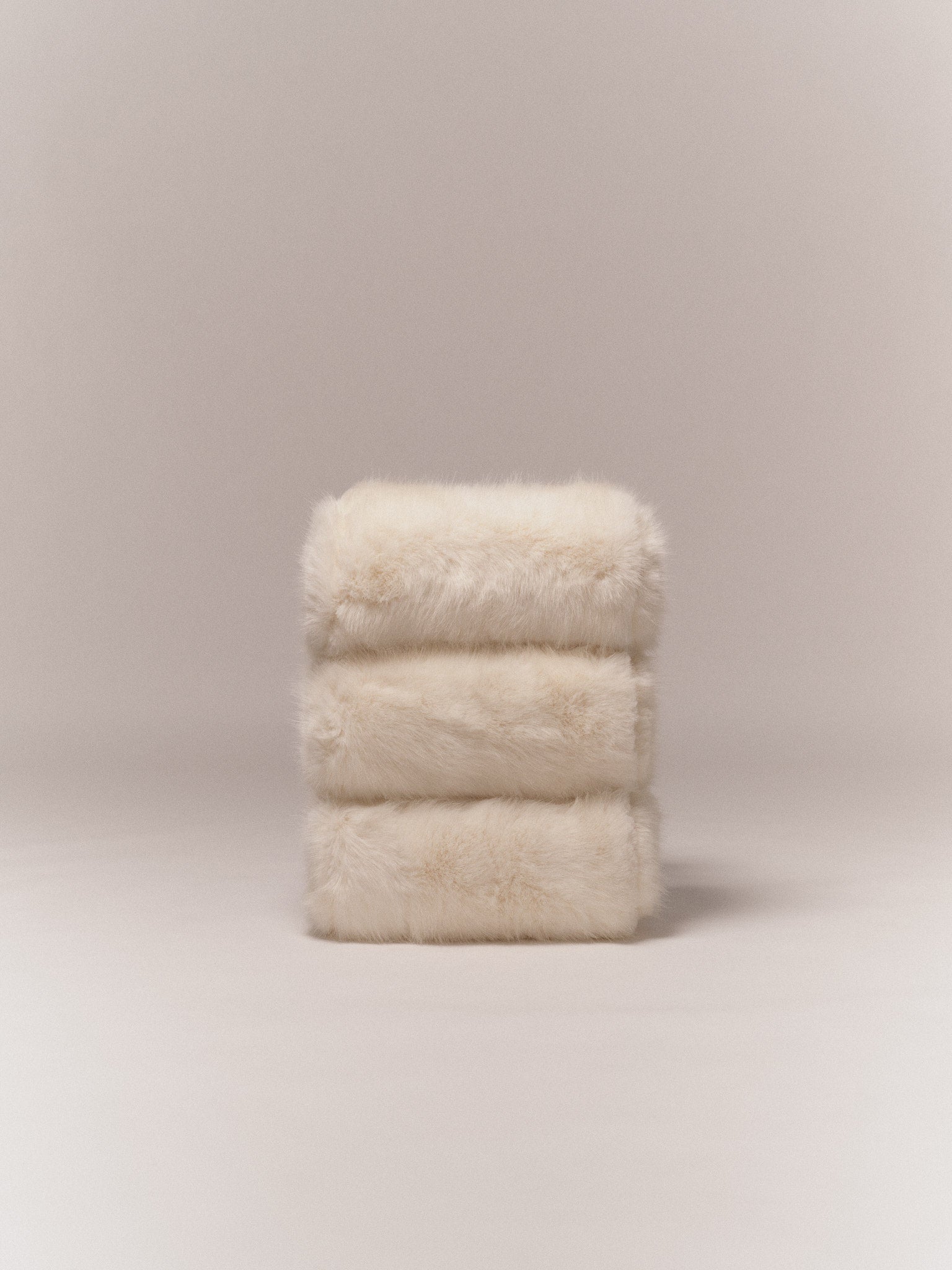 Poggia Bassa — back view showing soft cream upholstery