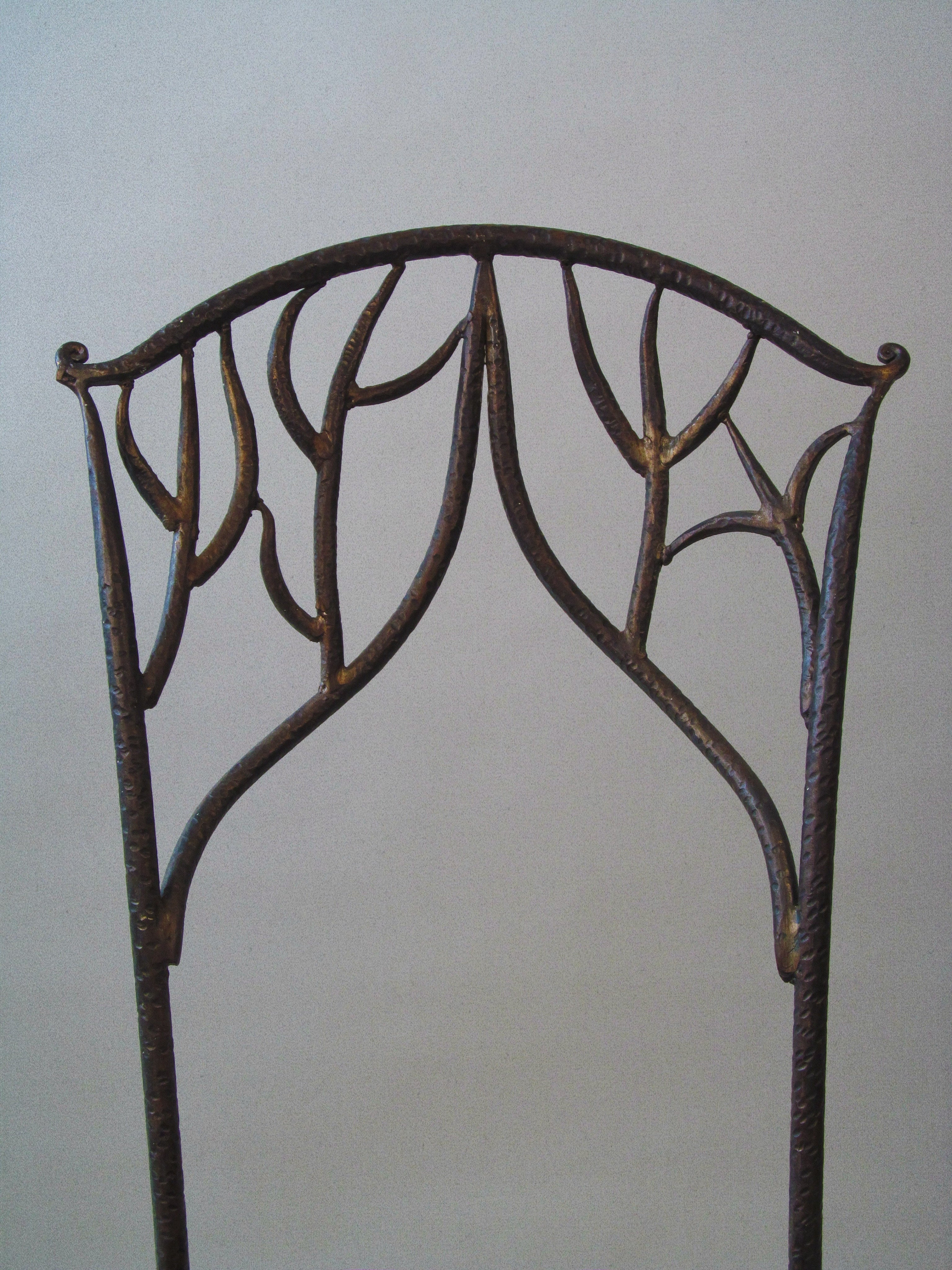Fer Forgé Dining Chairs (Pair) — close-up of wrought iron backrest design