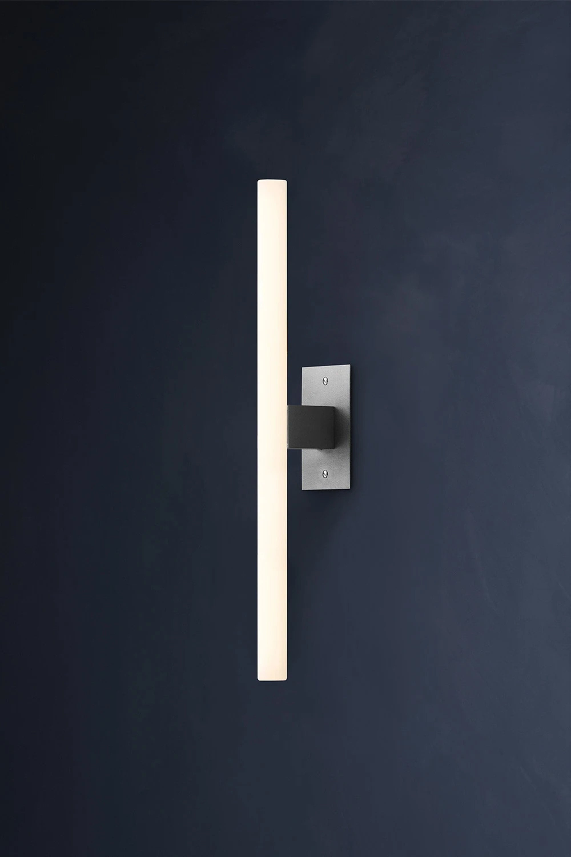 NEA WALL PLATE 50 — wall-mounted light against dark background