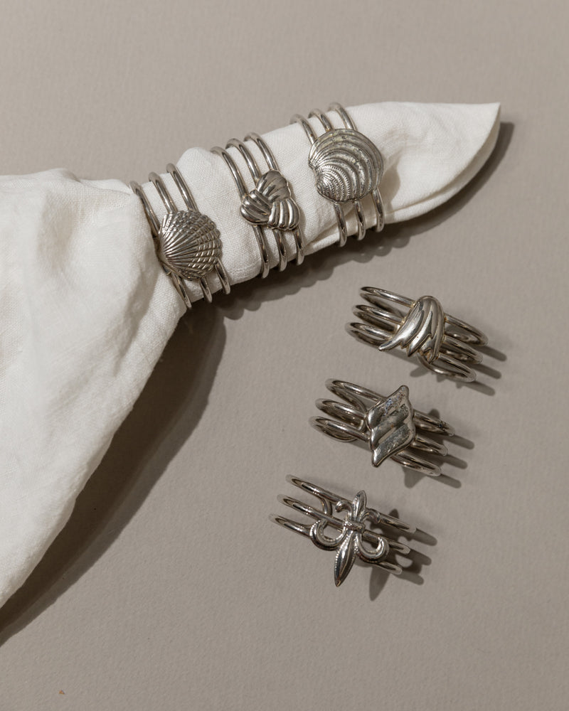 Set of 6 vintage silver napkin rings with shell and knot motifs