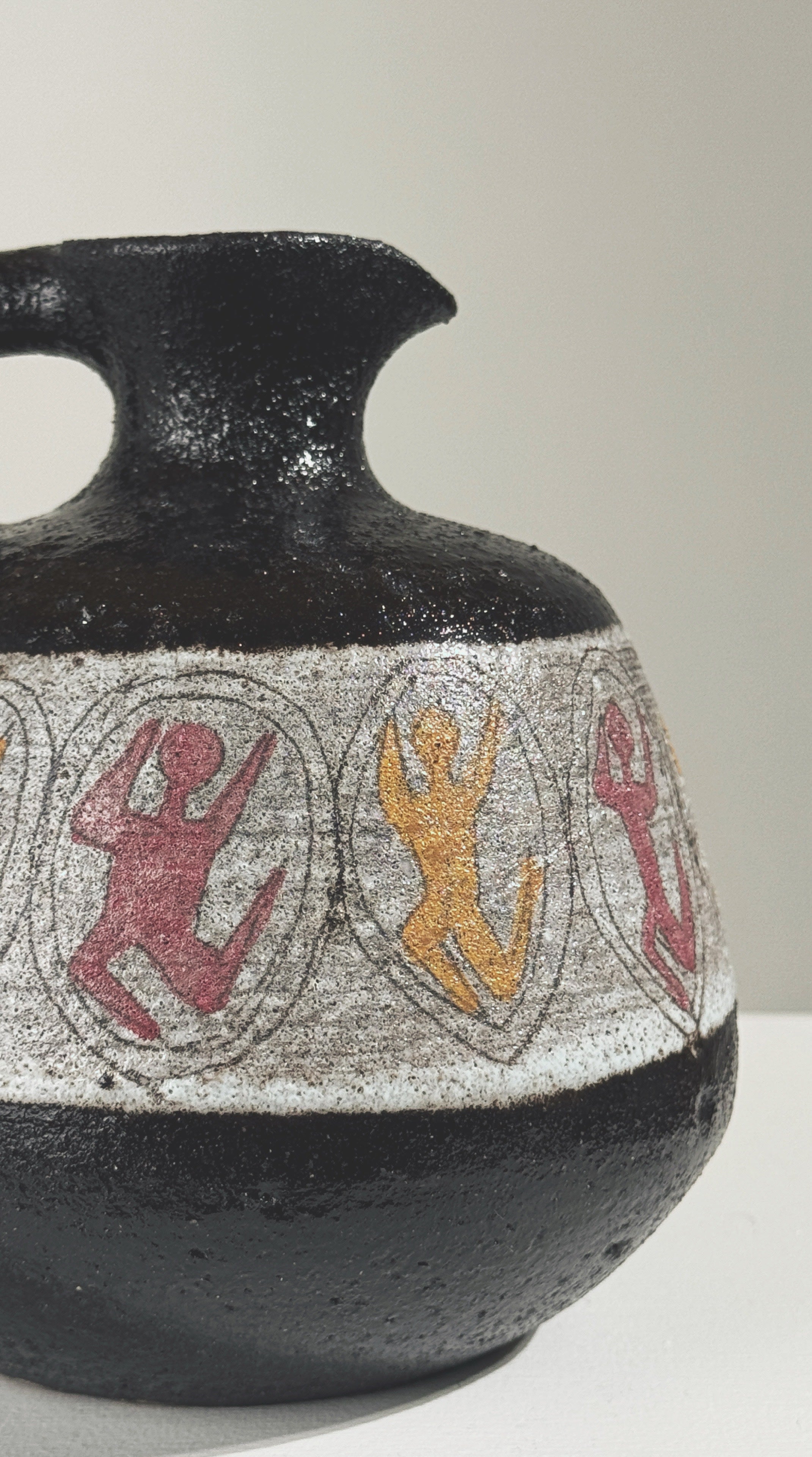 Detail of painted figurative motifs on Accolay stoneware pitcher