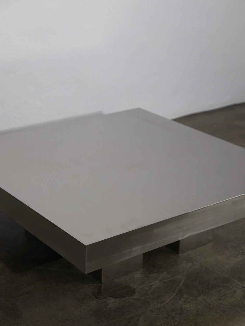 Block Coffee Table — close-up of brushed metal surface