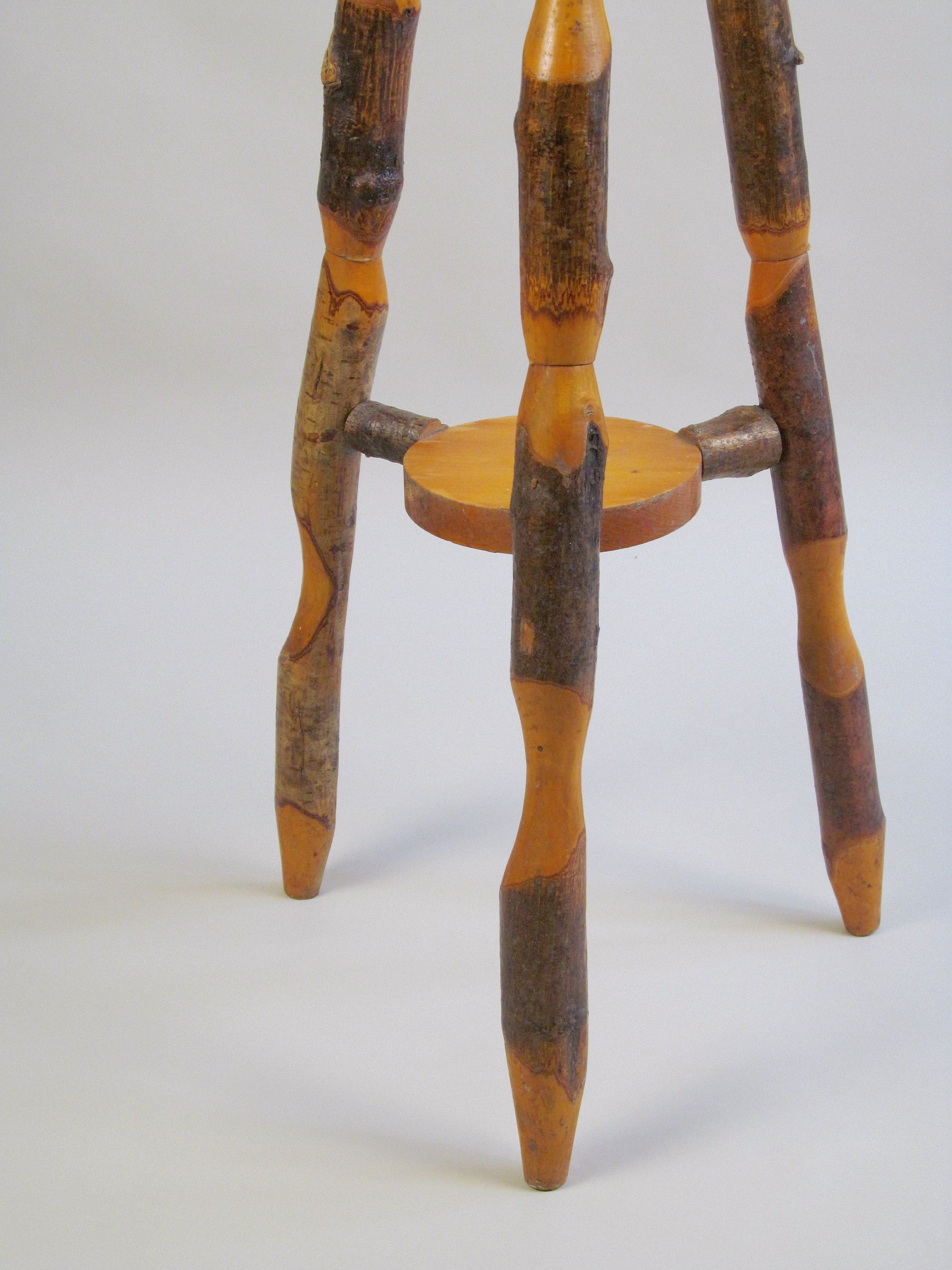 Naturalistic Wooden End Table — side angle showing rustic wooden legs