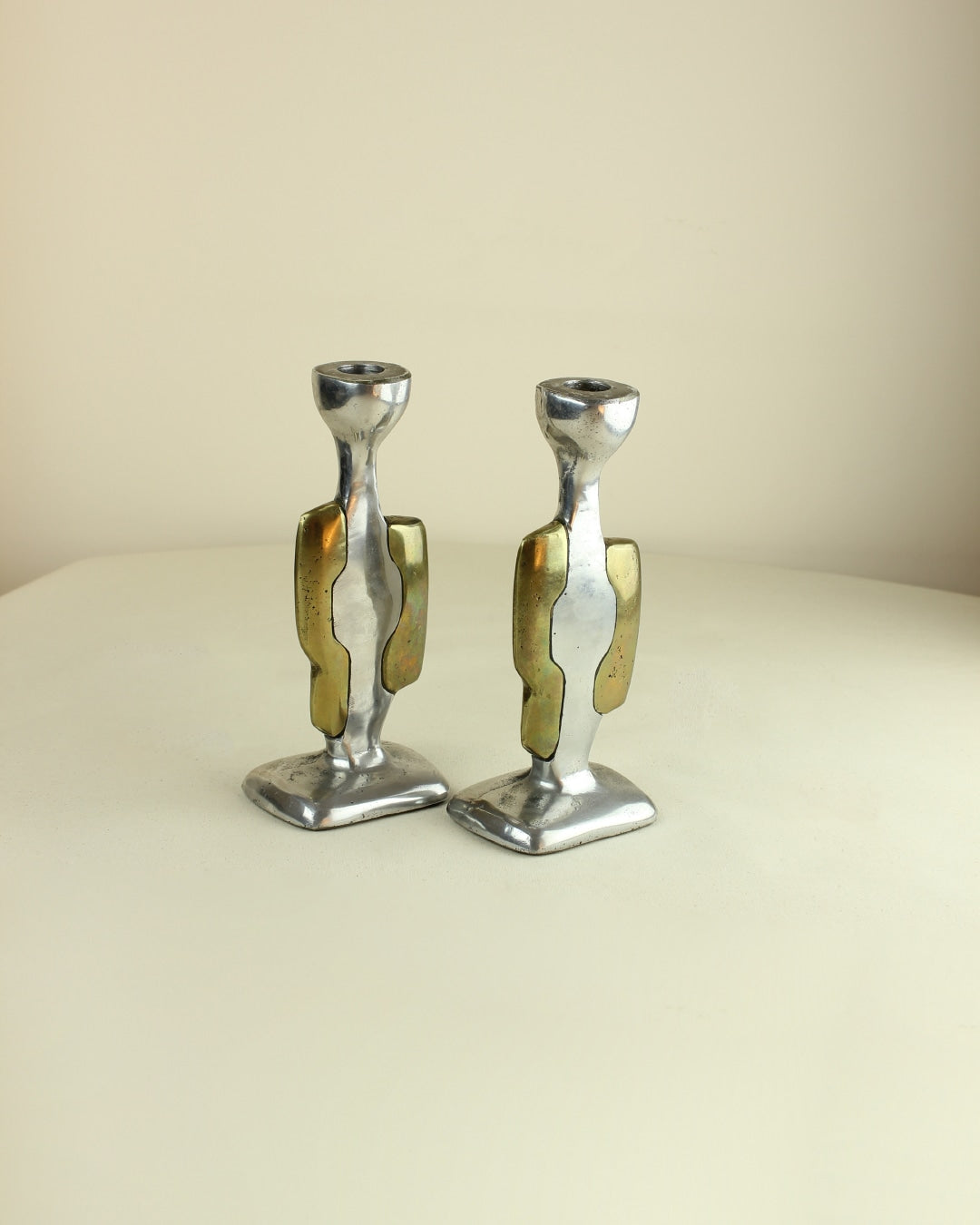 Brutalist Candleholders — side angle showing metallic finish and design