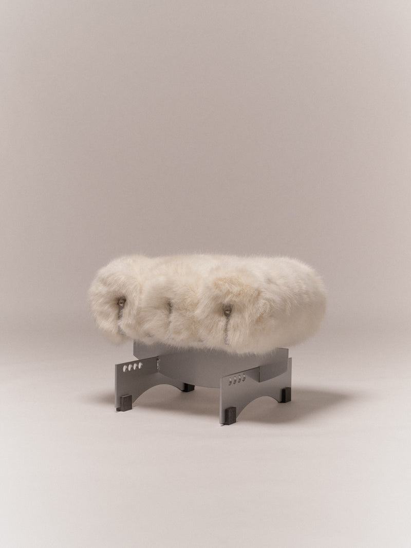 Poggia Bassa — close-up of soft fur seat on metal base