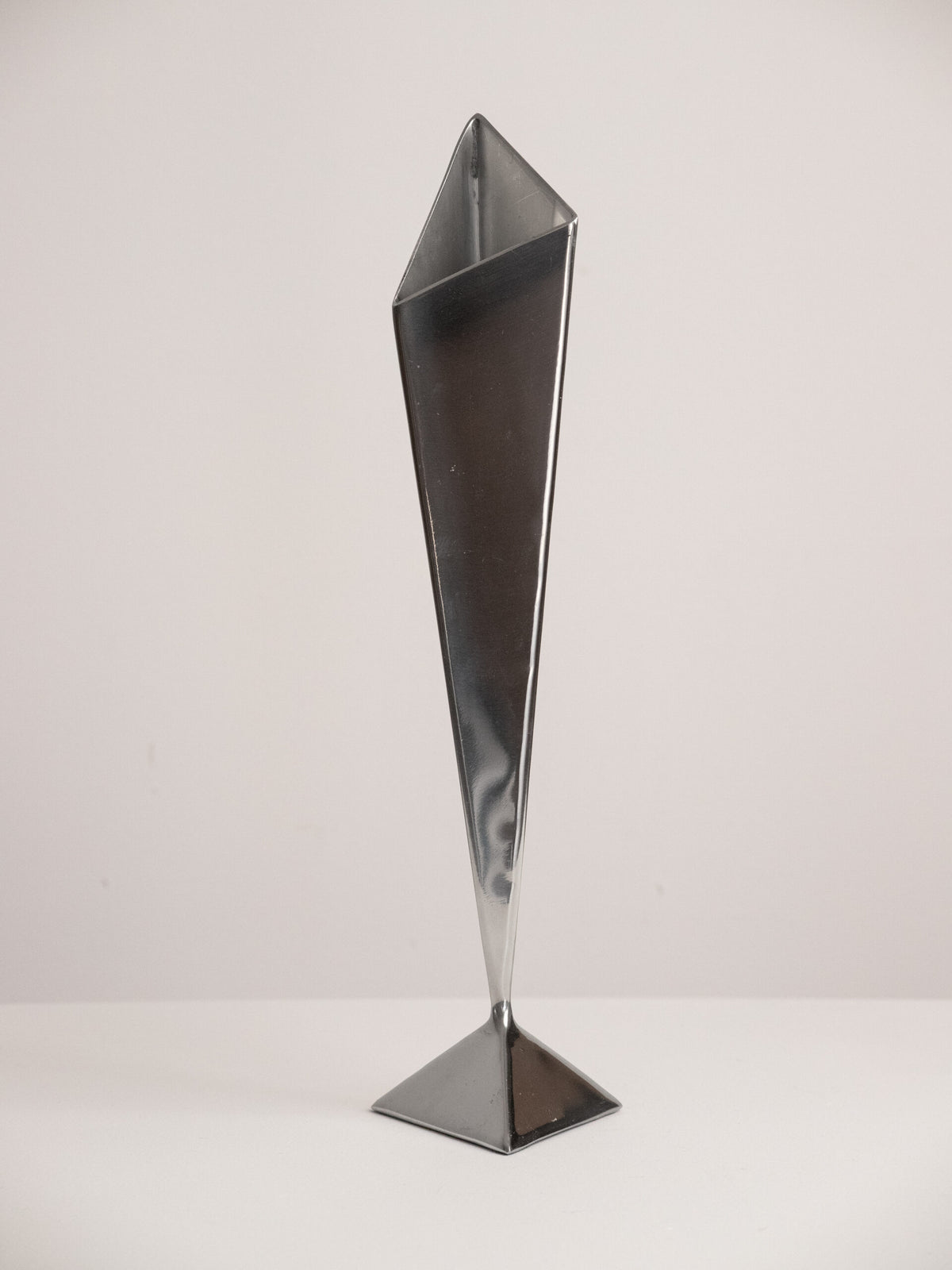 Folded Stainless Steel Bud Vase, Inverted Cone on Triangular Pyramid Foot, Space Age, 1960s-1970s — lifestyle setting
