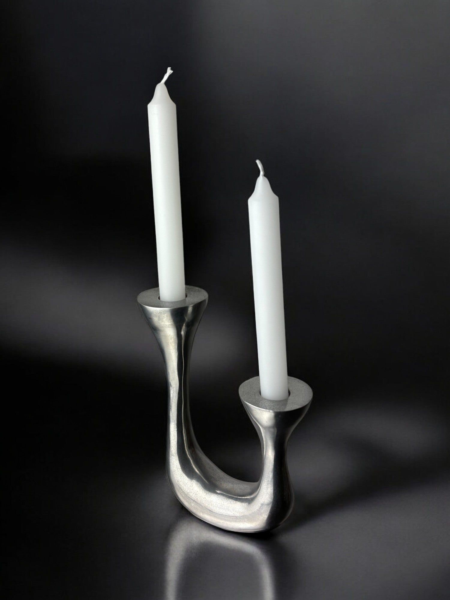 Biomorphic Candleholder, Aluminum, Spain, Circa 1970s — side angle on dark background