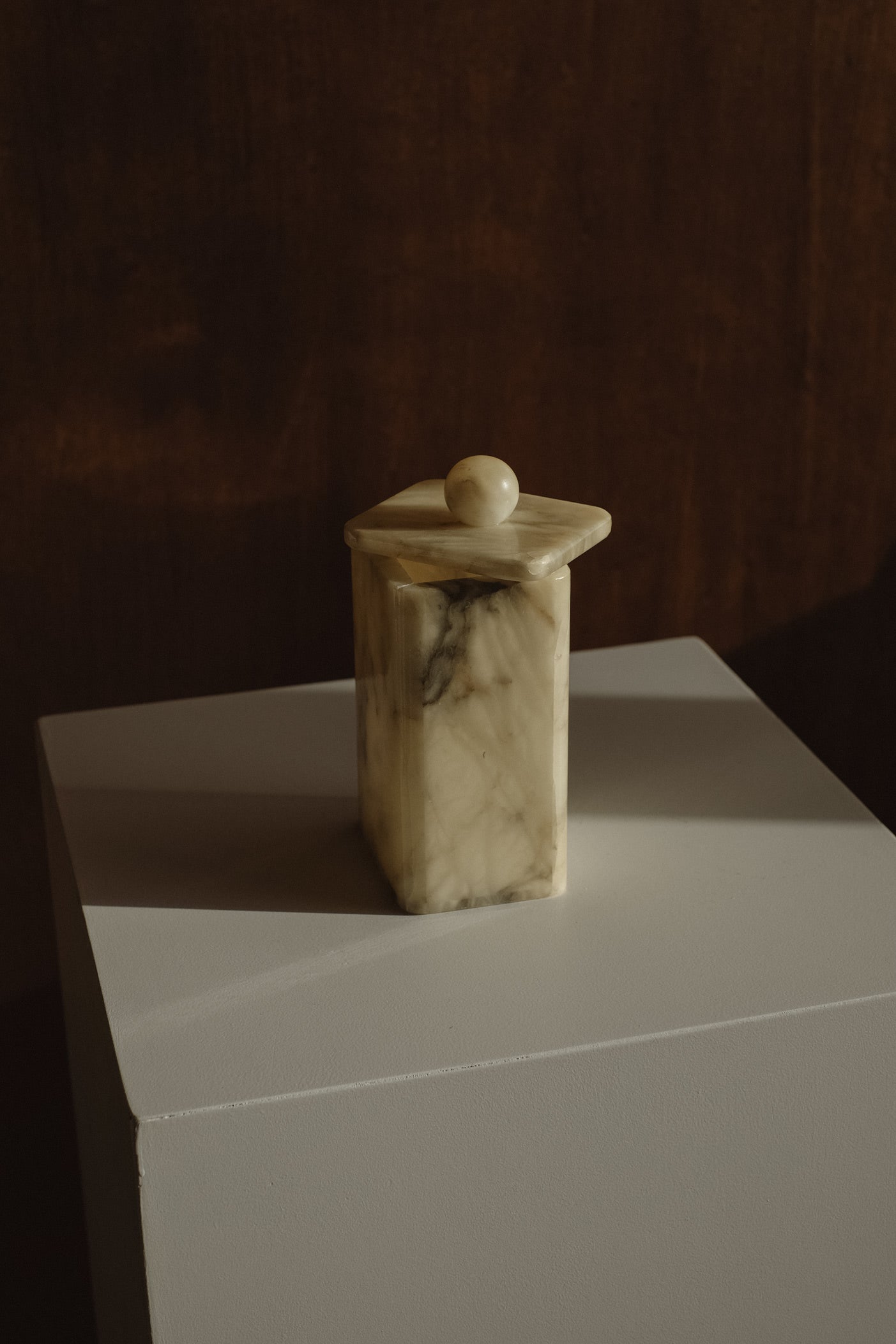 Vintage Onyx Jar — top view on white pedestal with soft lighting