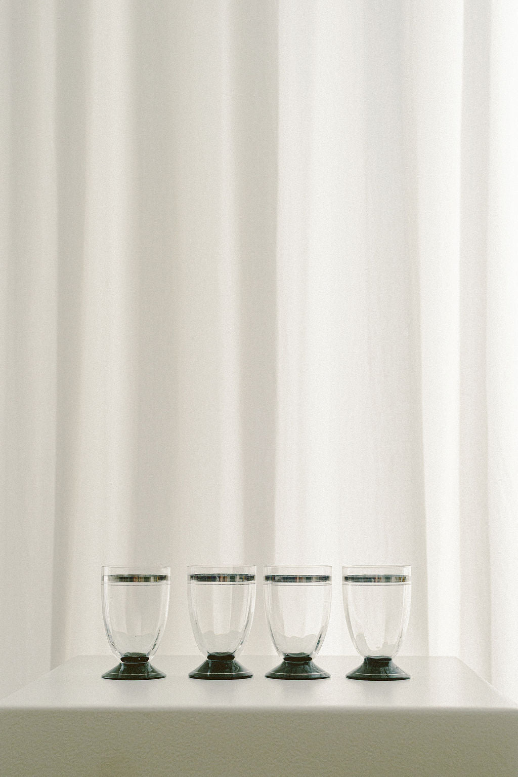Vintage Art Deco Liqueur Glasses with Silver Bands — close-up on clear glass with silver bands
