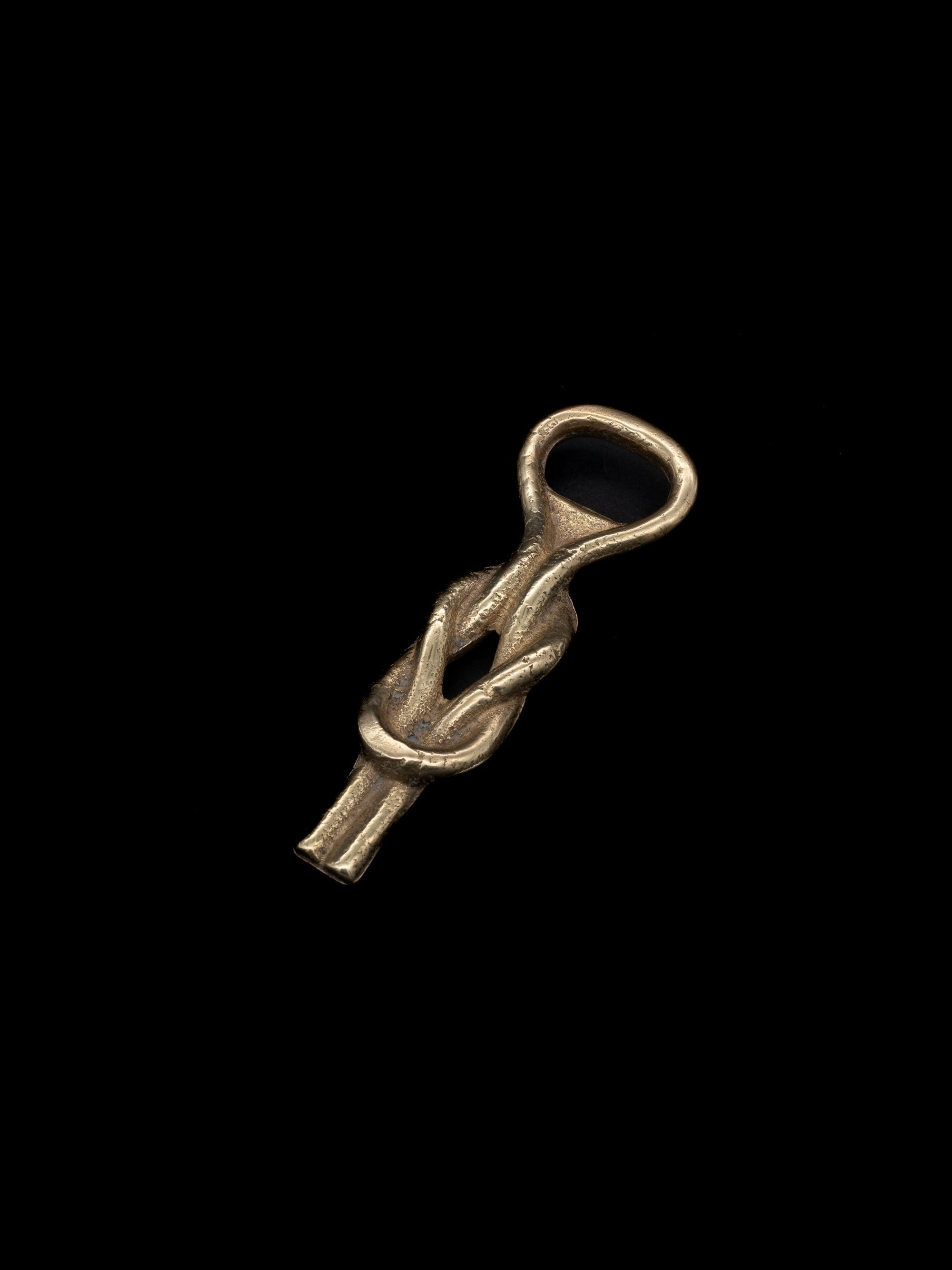 Sailor’s Knot Bottle Opener, Italy, c. 1960s — side angle showing twisted brass design