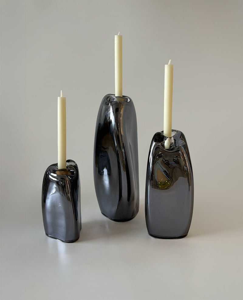 Lumos Smoke Candle Holders — close-up of glossy black glass surface