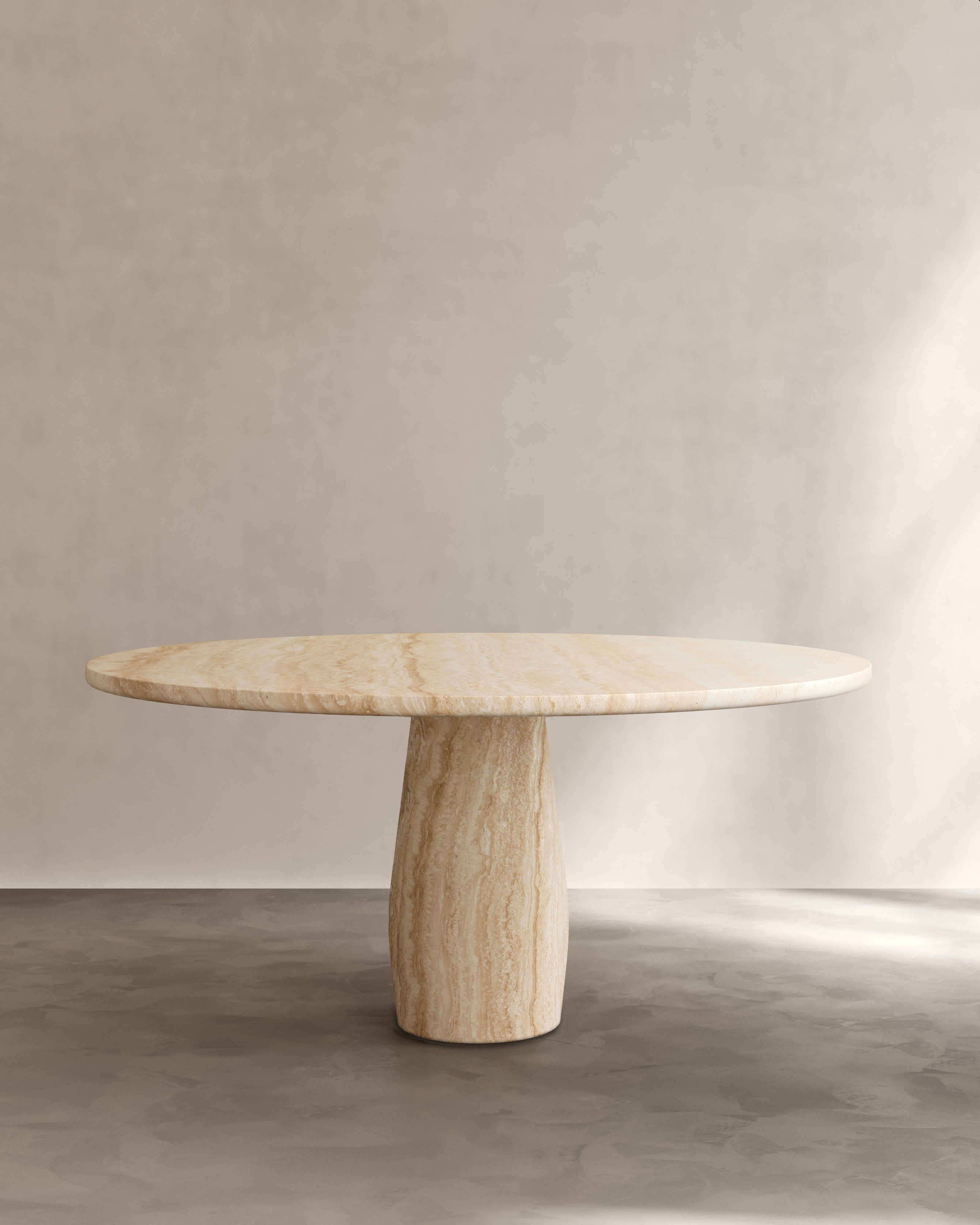 Raffaella Table III — top view of round stone dining table