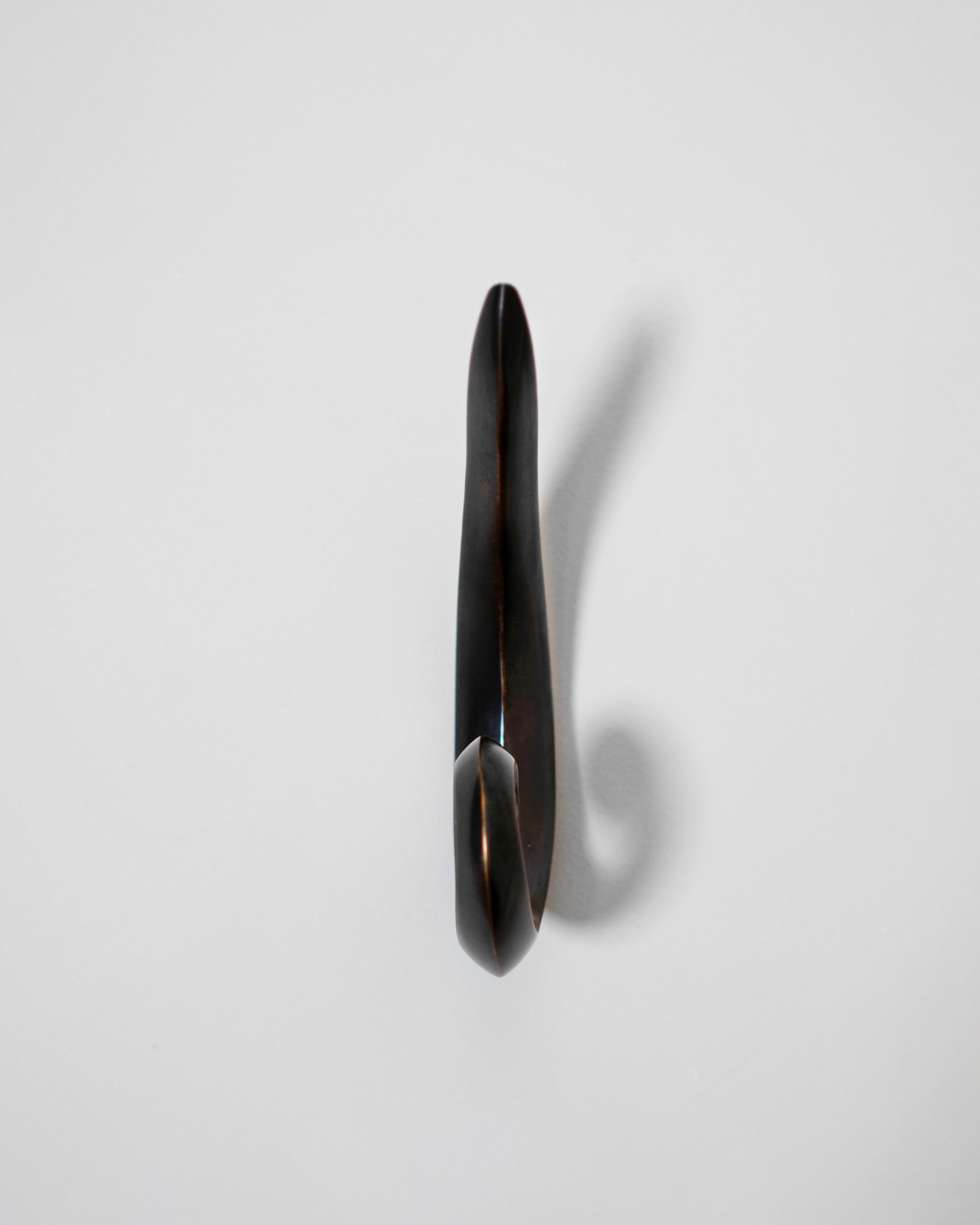 Noelle Hook - Antique Brass — top view on white background