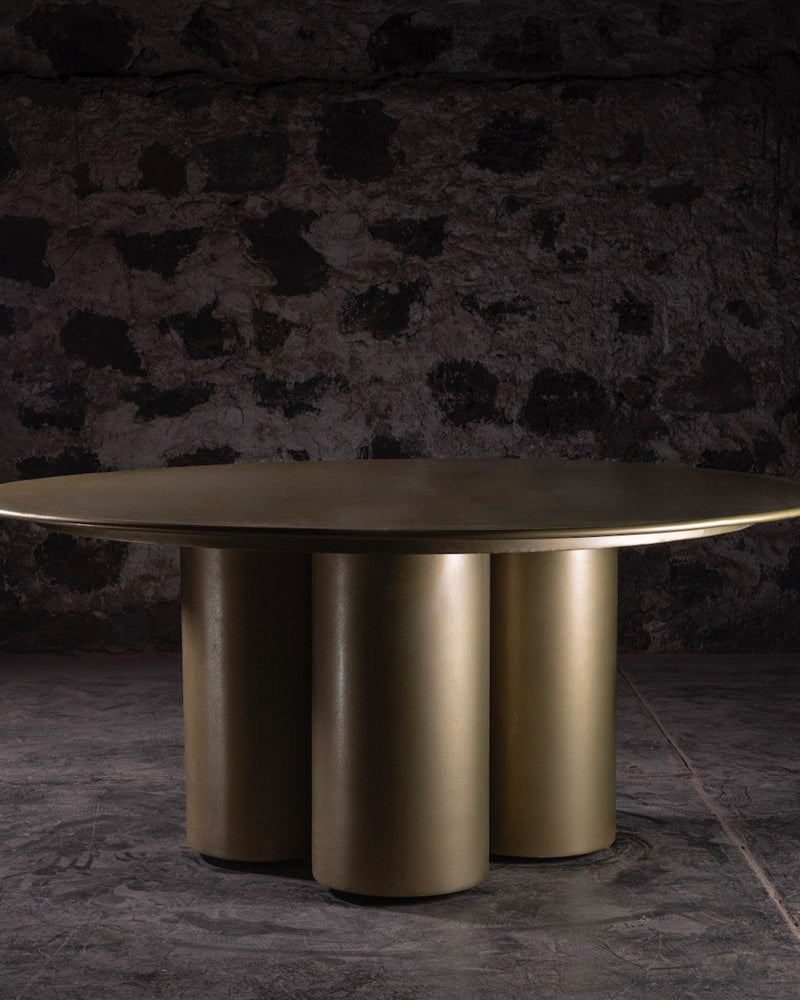 014 Steel Dining Table — close-up of round brass top and cylindrical base