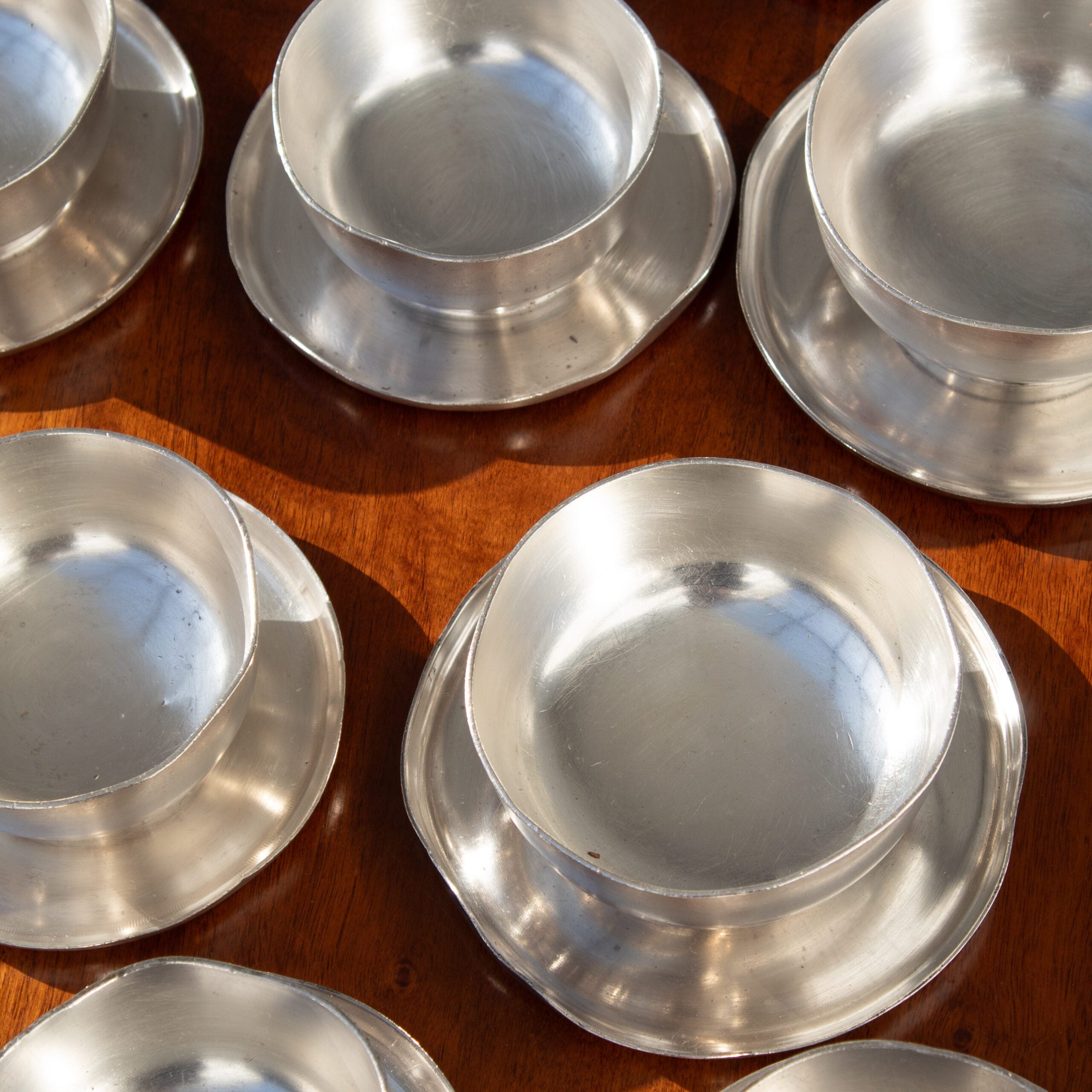 Metal Serving Bowl - Arthur Krupp — top view of polished metal bowls on wood