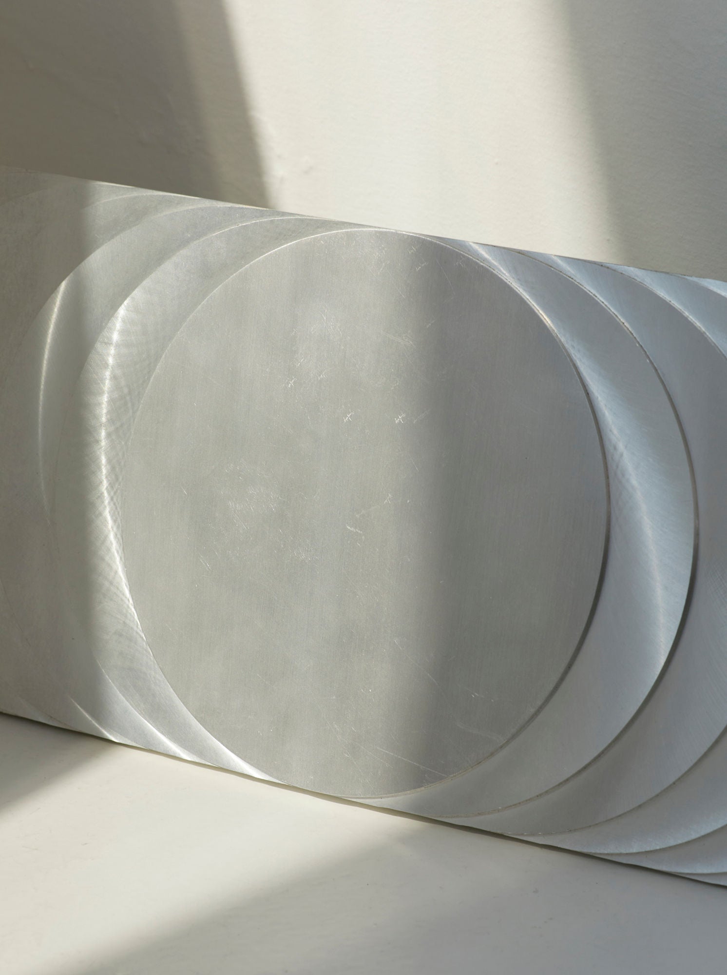 ‘The Sun’s Path' Steel Wall Sculpture By Anonymous French Artist Circa 1970 — angled view showing brushed metal surface