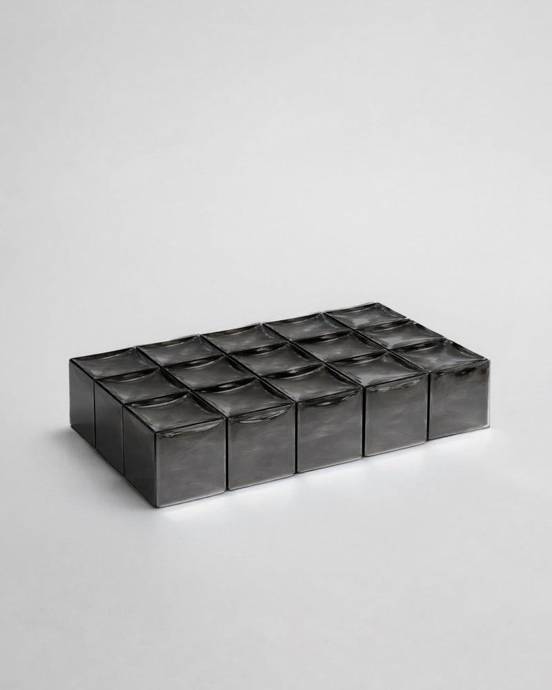 MONOLIT' Coffee Table — close-up of dark glass surface texture
