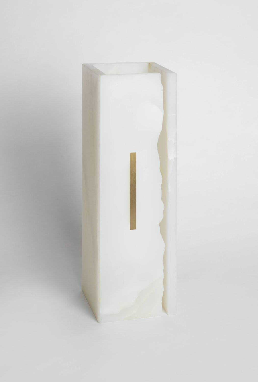 03C PURE WHITE ONIX Collectible Lighting in stone — side angle showing onyx texture and brass detail