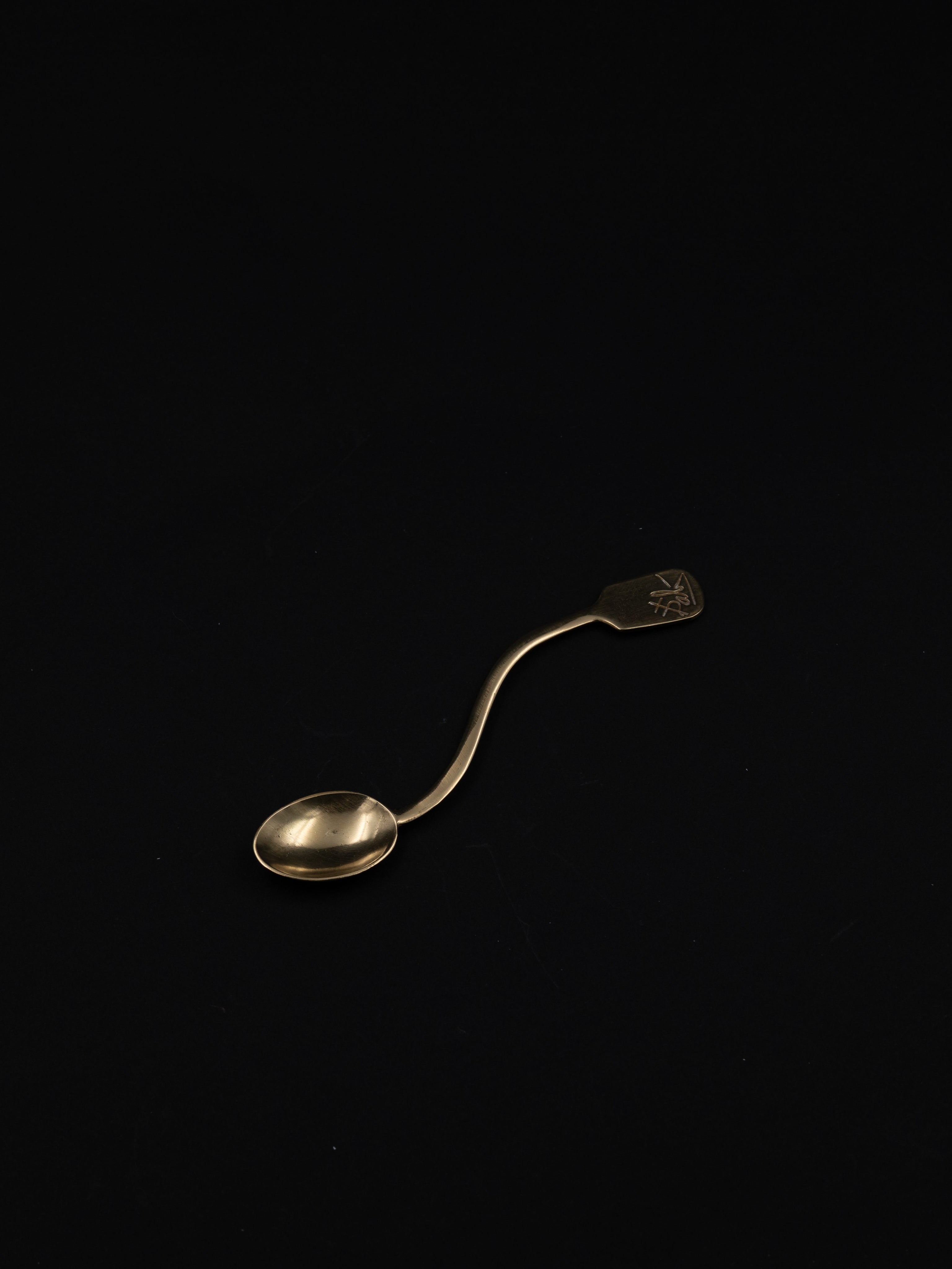Salvador Dalí 'The Soft Spoon', Spain, c. 1967 — side angle of brass spoon on black background