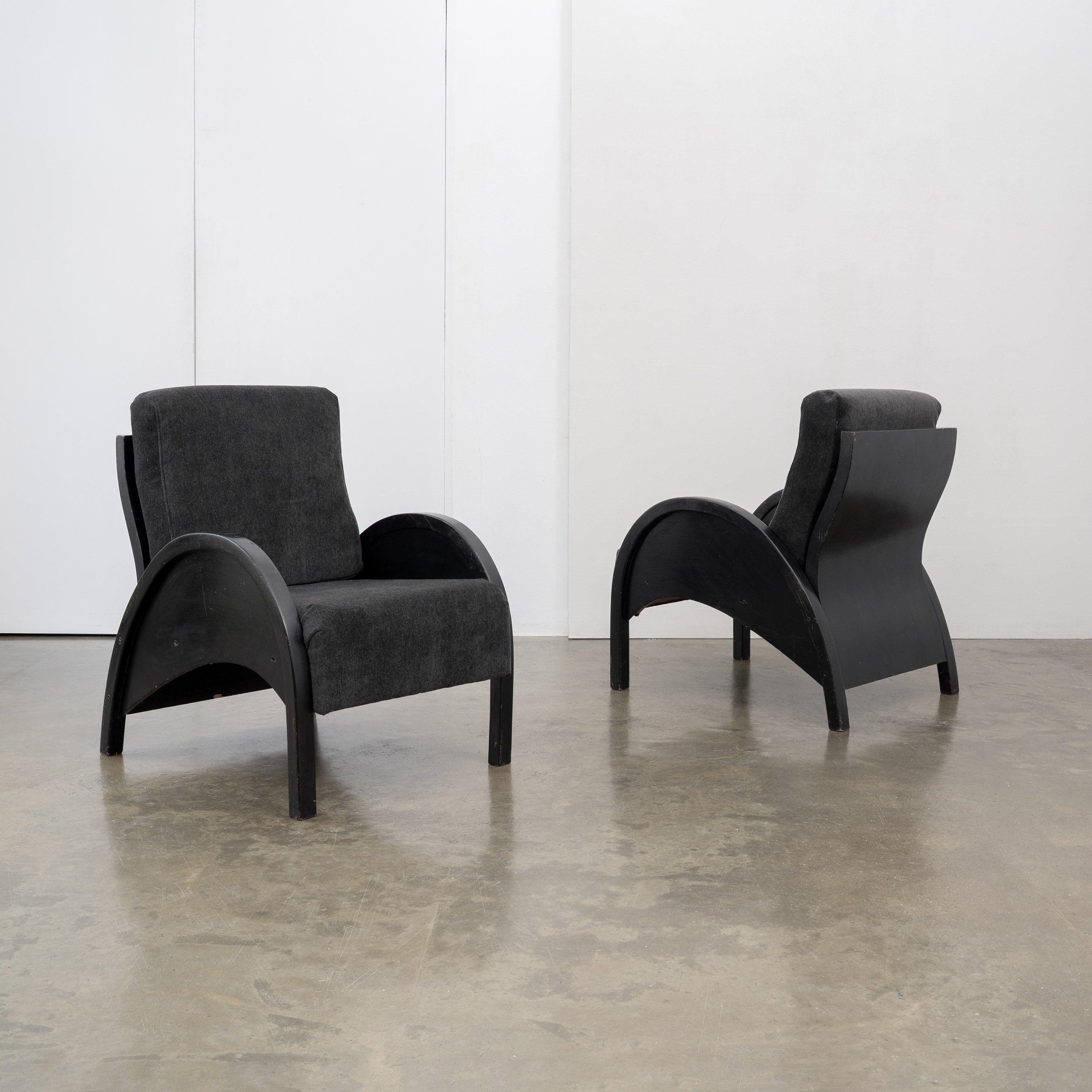 Modernist Armchairs, c.1950 — angled view of black upholstered armchair