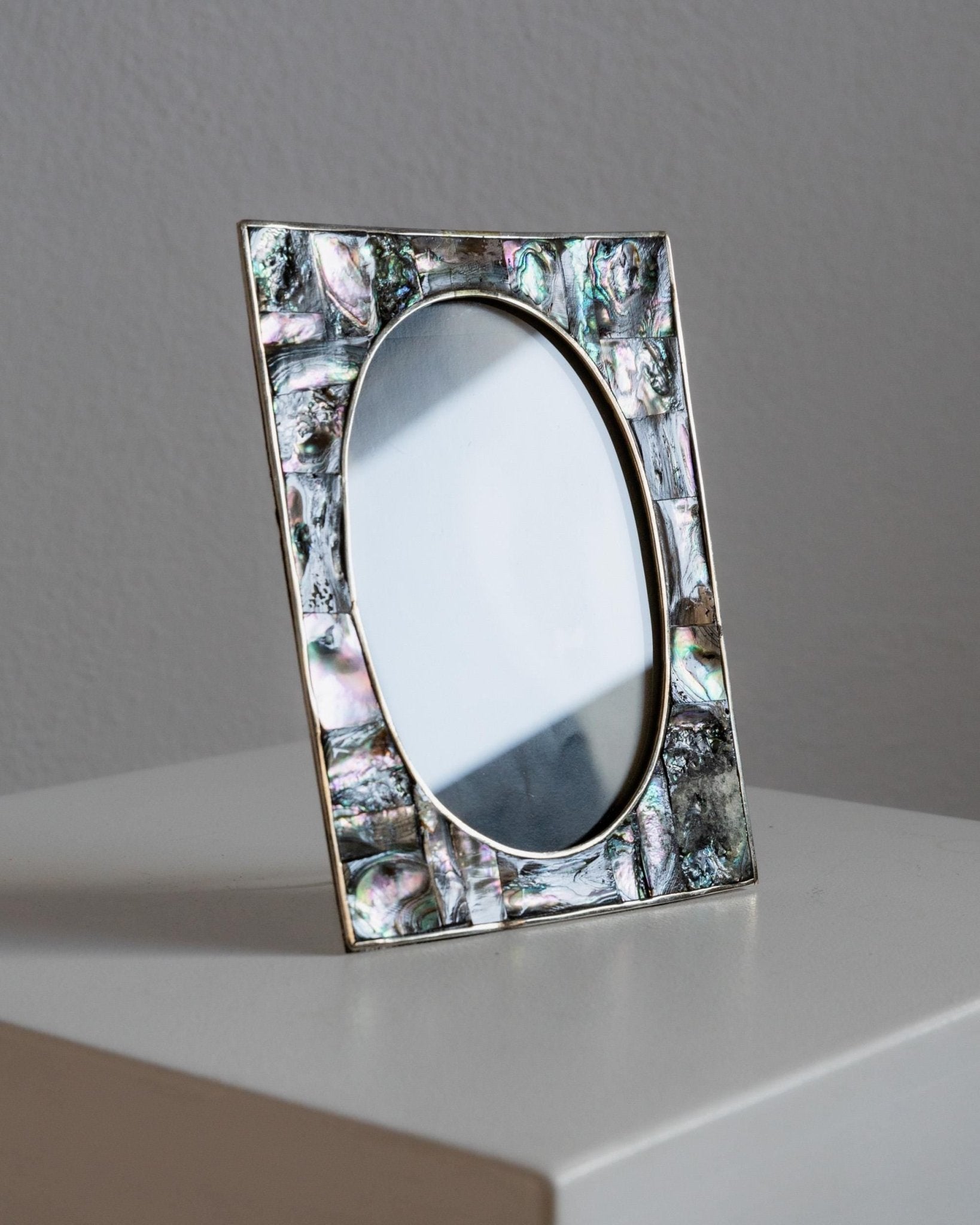 Vintage 1950s Alpaca Silver Picture Frame, Mother of Pearl Details with Oval Photo Opening, Elegant Table Accent, Timeless Gift Idea — lifestyle setting