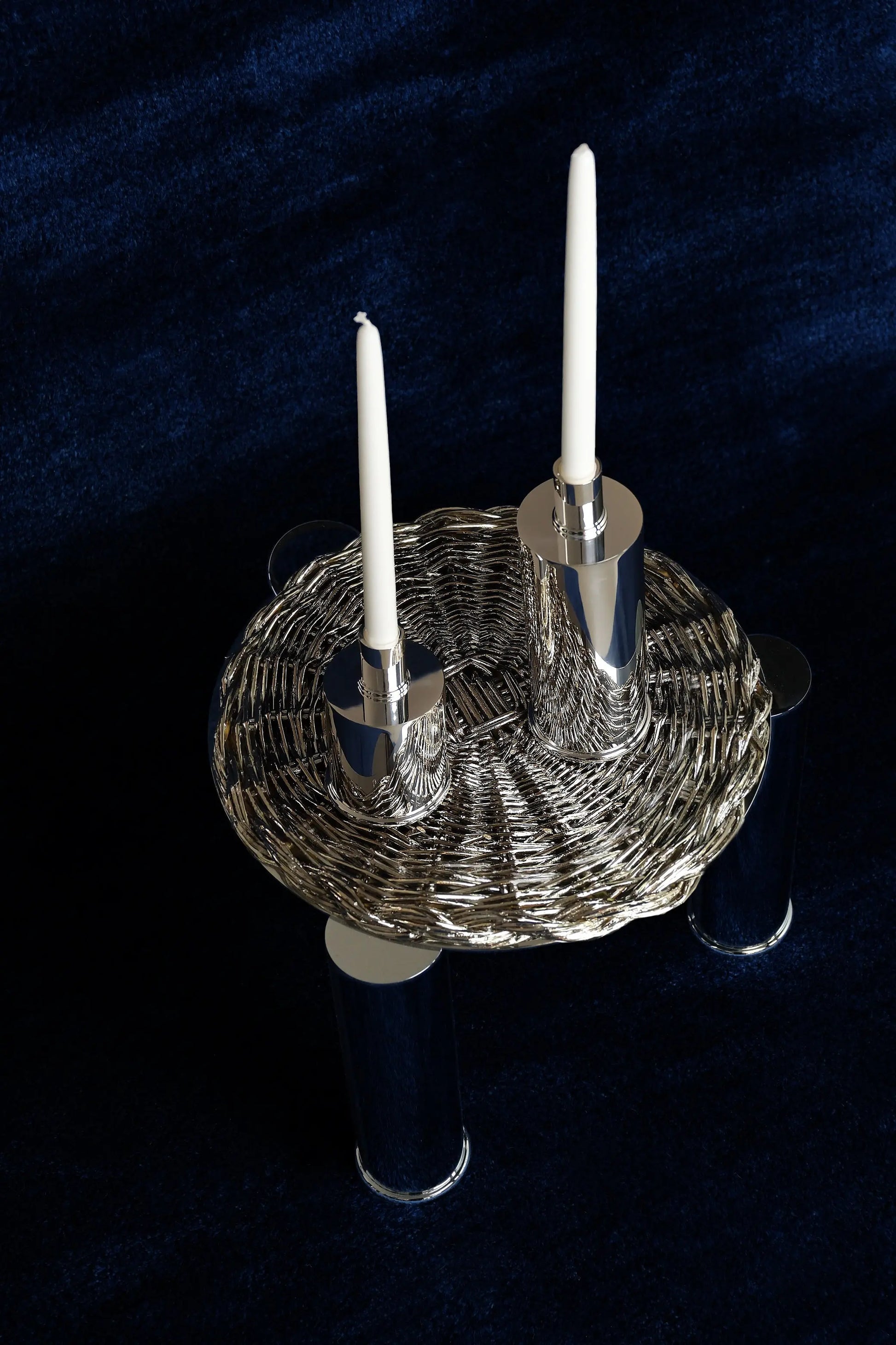 Elegant Candle Holders Silver Plated — top view on dark fabric background