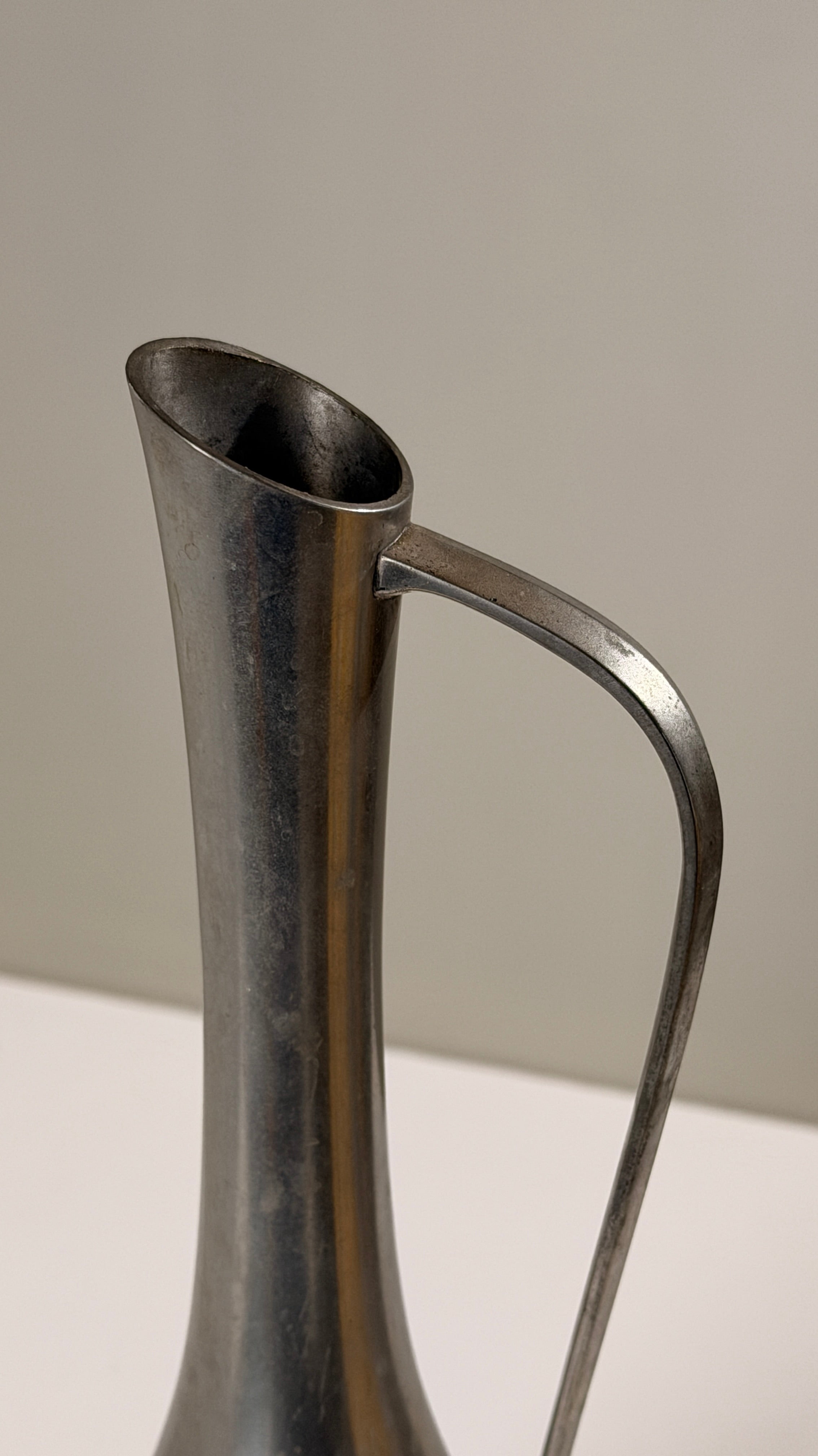 Pewter Pitcher, Paris, France, circa 1930 — side angle showing polished metal surface