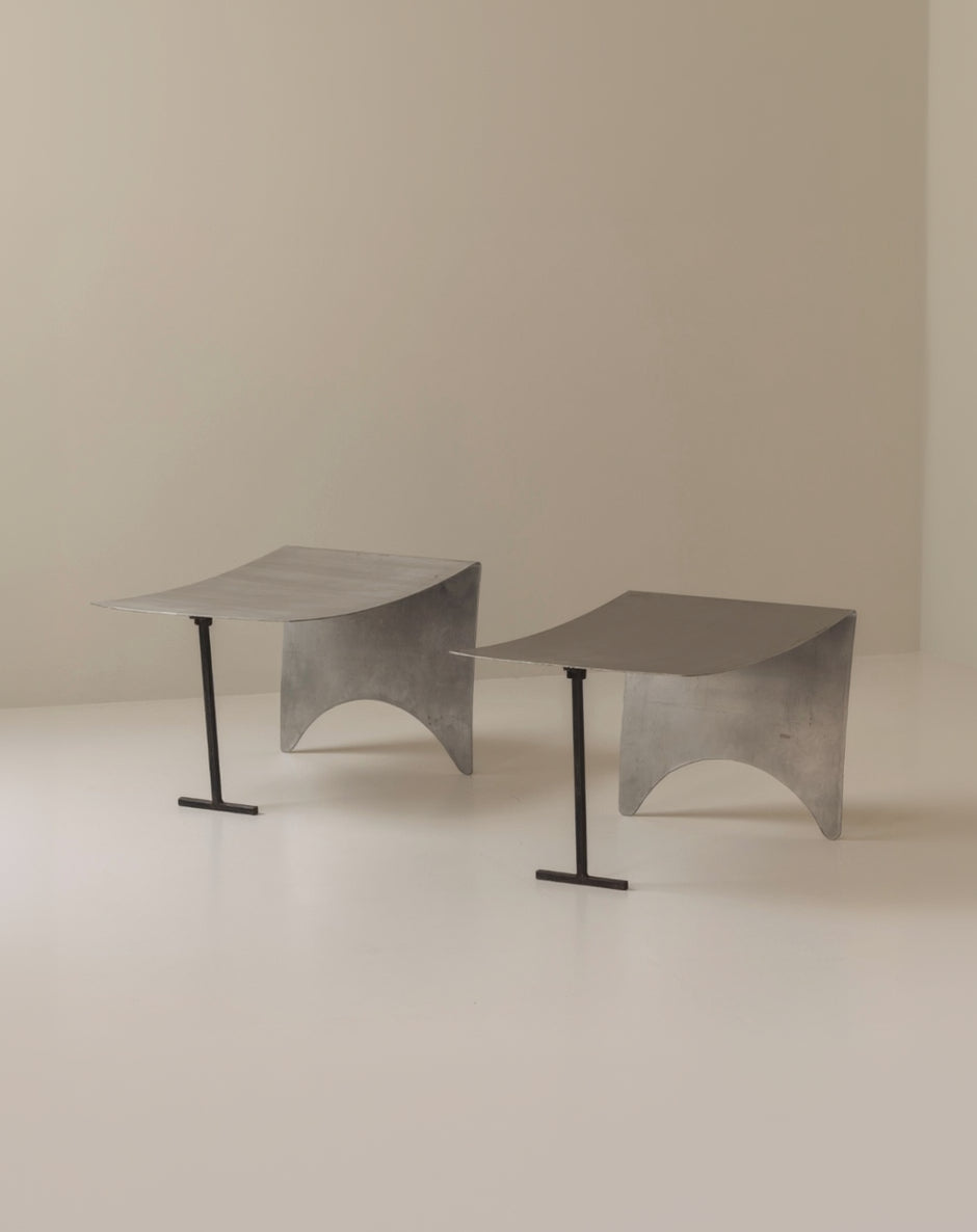 A striking set Modernist curved metal stools from France, dating to the 1980s. — alternate view