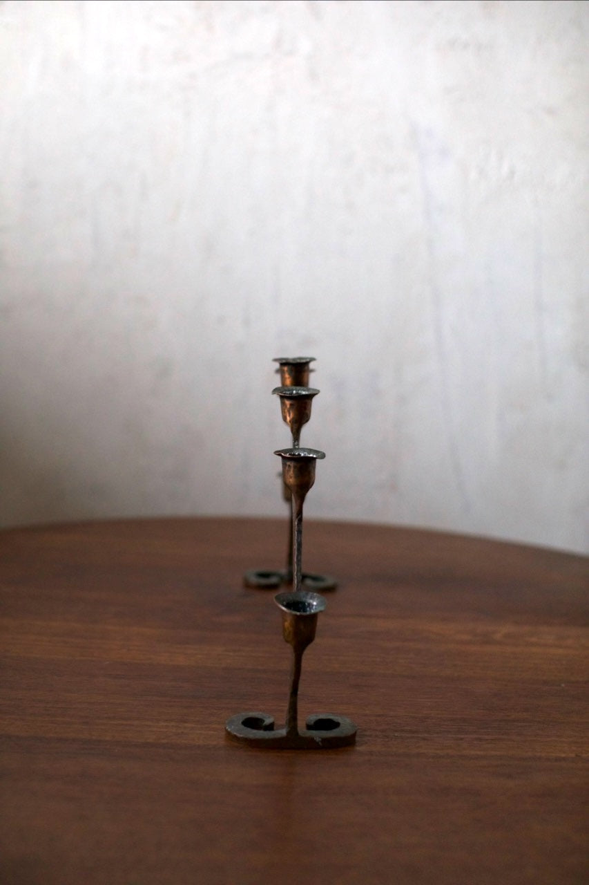 Bronze Candleholder — top view on wooden surface with three holders