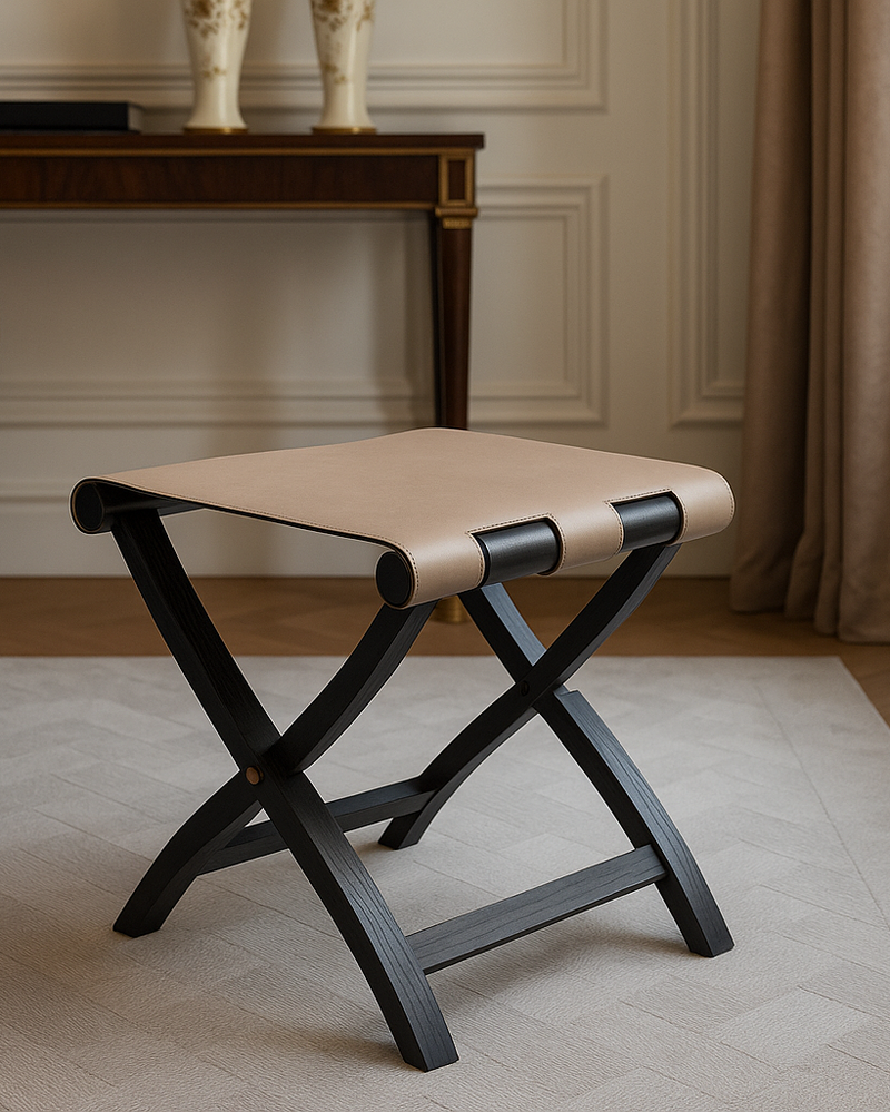 Arturo folding stool with black wood frame and beige leather seat