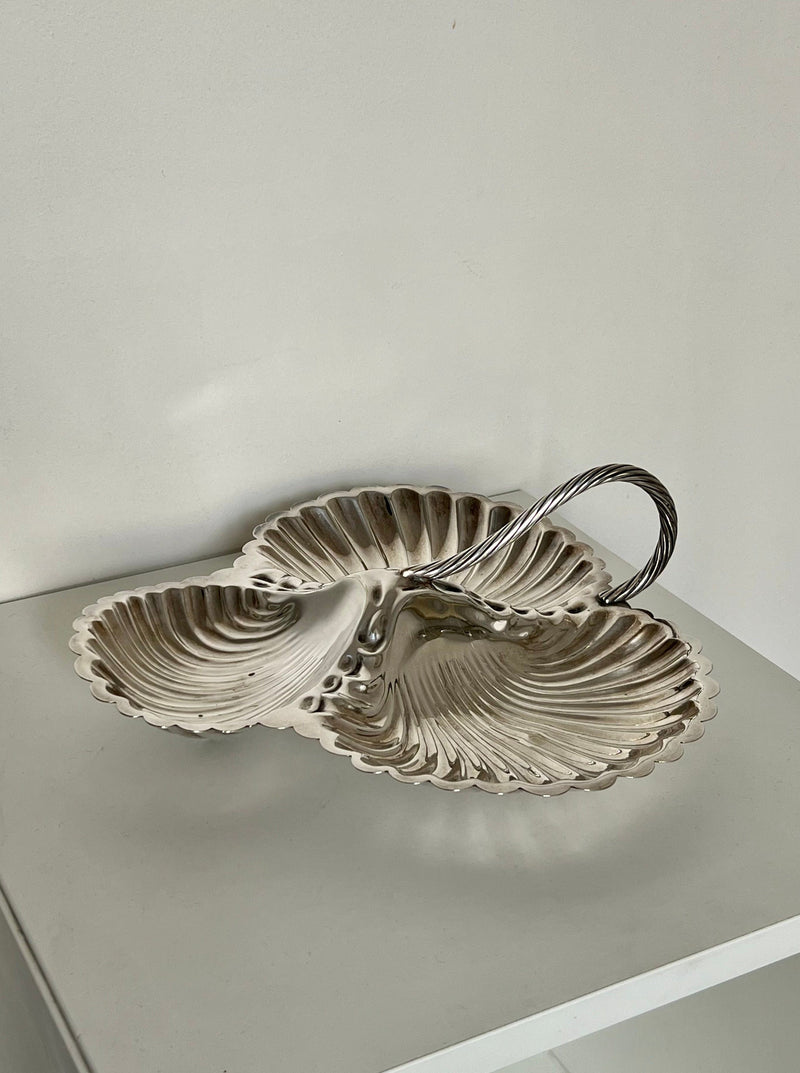 Silver triple shell serving dish with scalloped edges and twisted handle