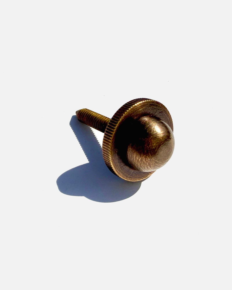 Brass knurled thumbscrew detail of Equinox pendant light