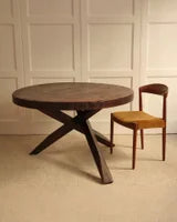 Circular wooden table — side angle