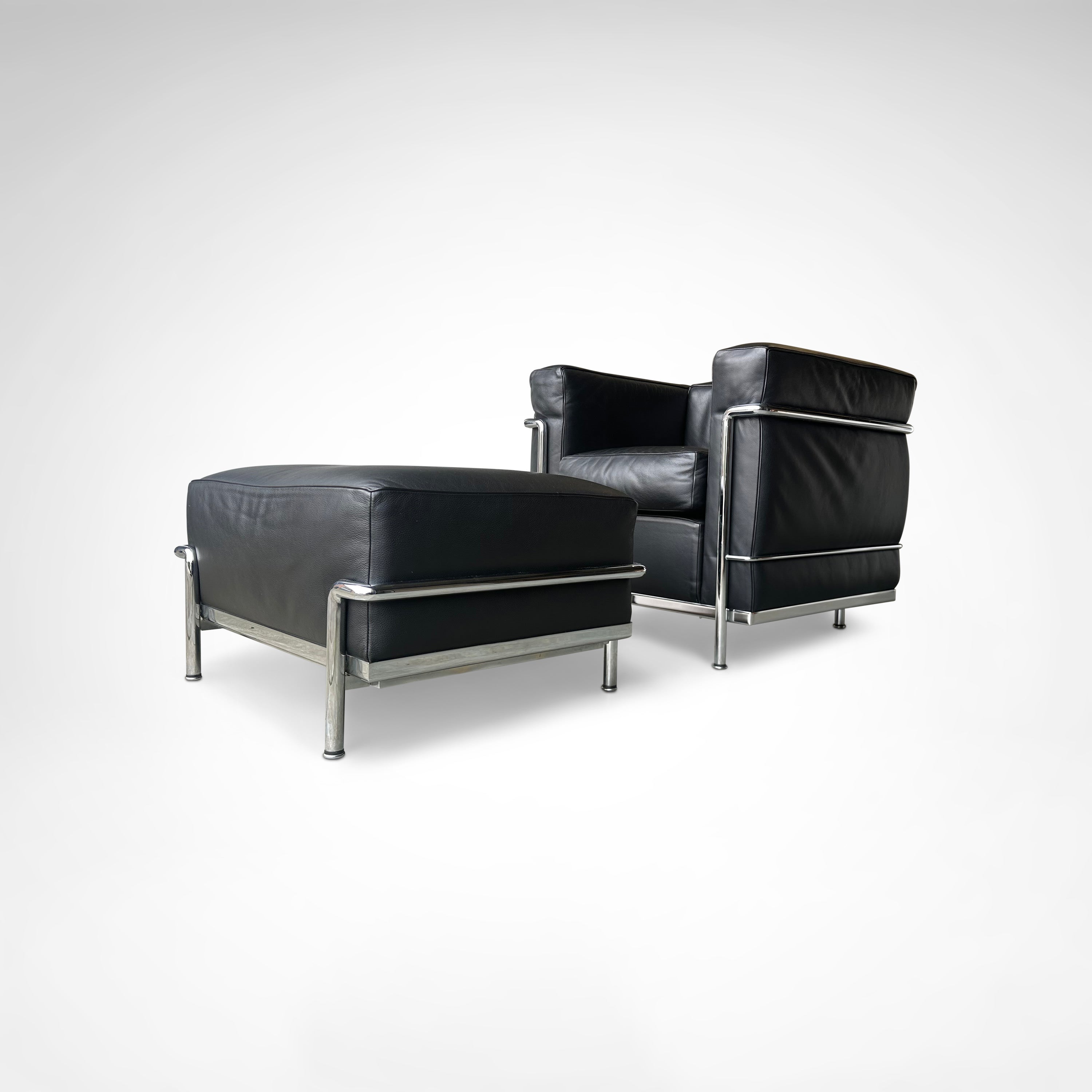 LC2 Armchair and Ottoman by Le Corbusier et al. for Cassina 1990s — back view showing black leather upholstery and chrome fra
