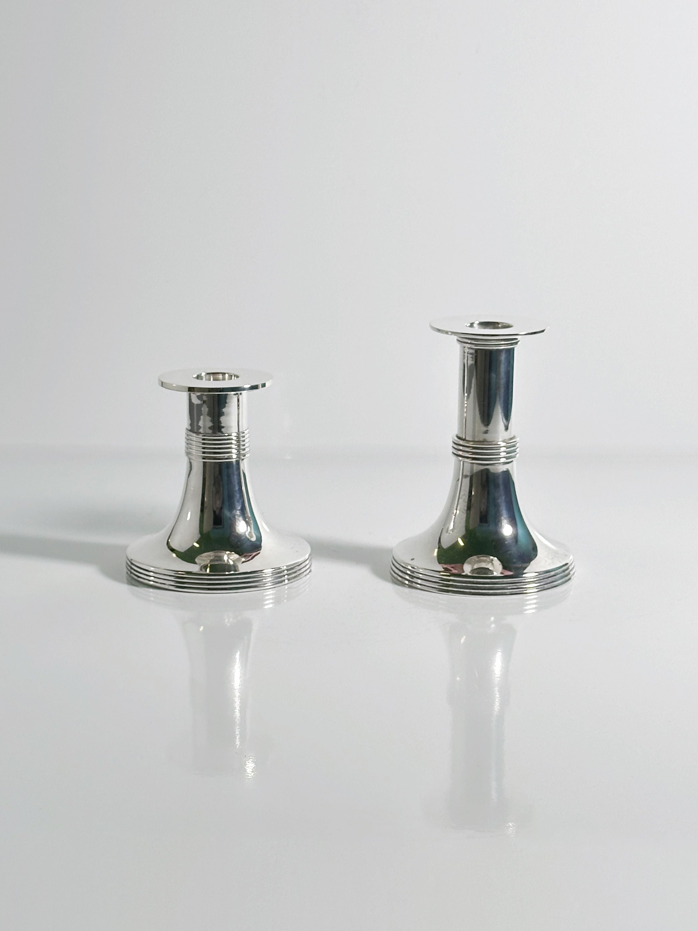 Pair of Silver Plated Candleholders by Gunther Lambert — side angle showing reflective surface