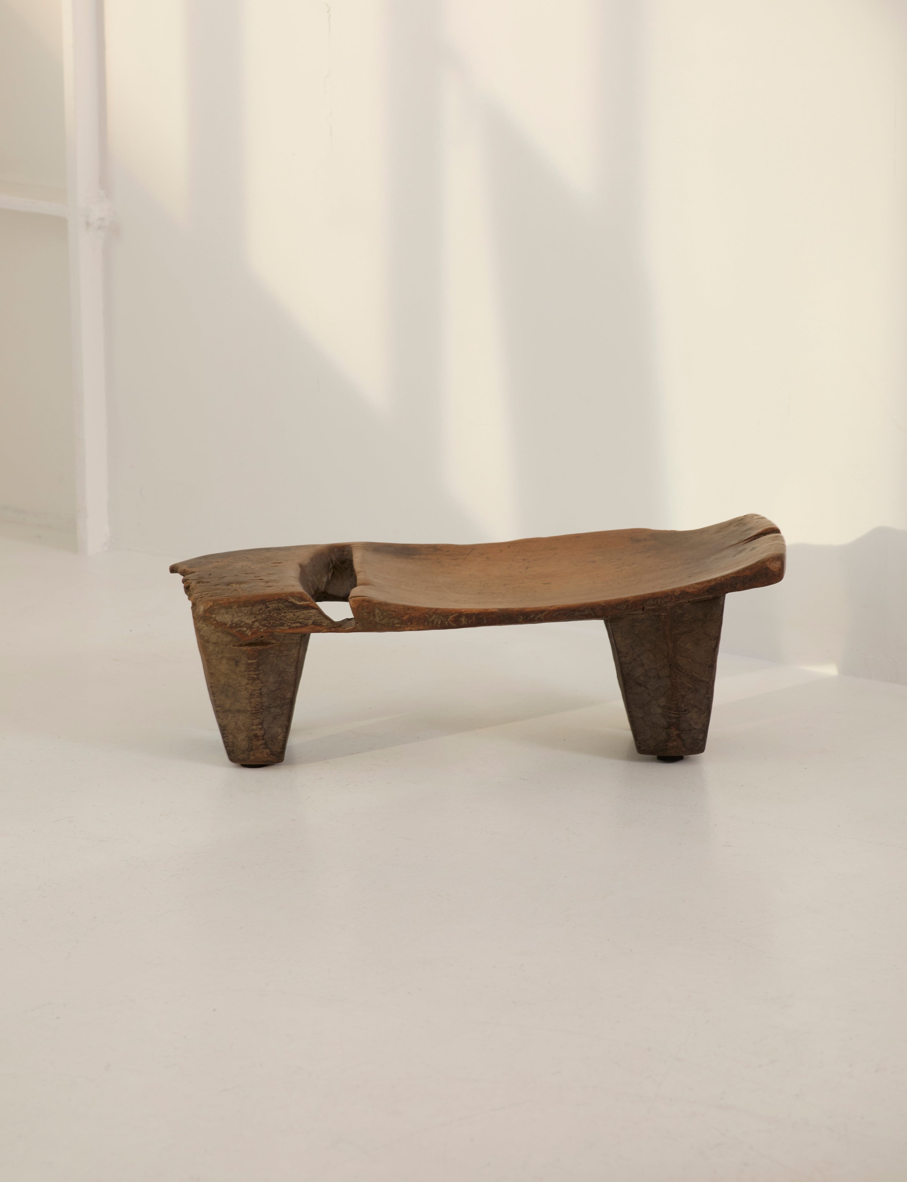 Mid-Century African Senufo Stool / Side Table in Solid Wood — side angle showing natural wood grain and legs