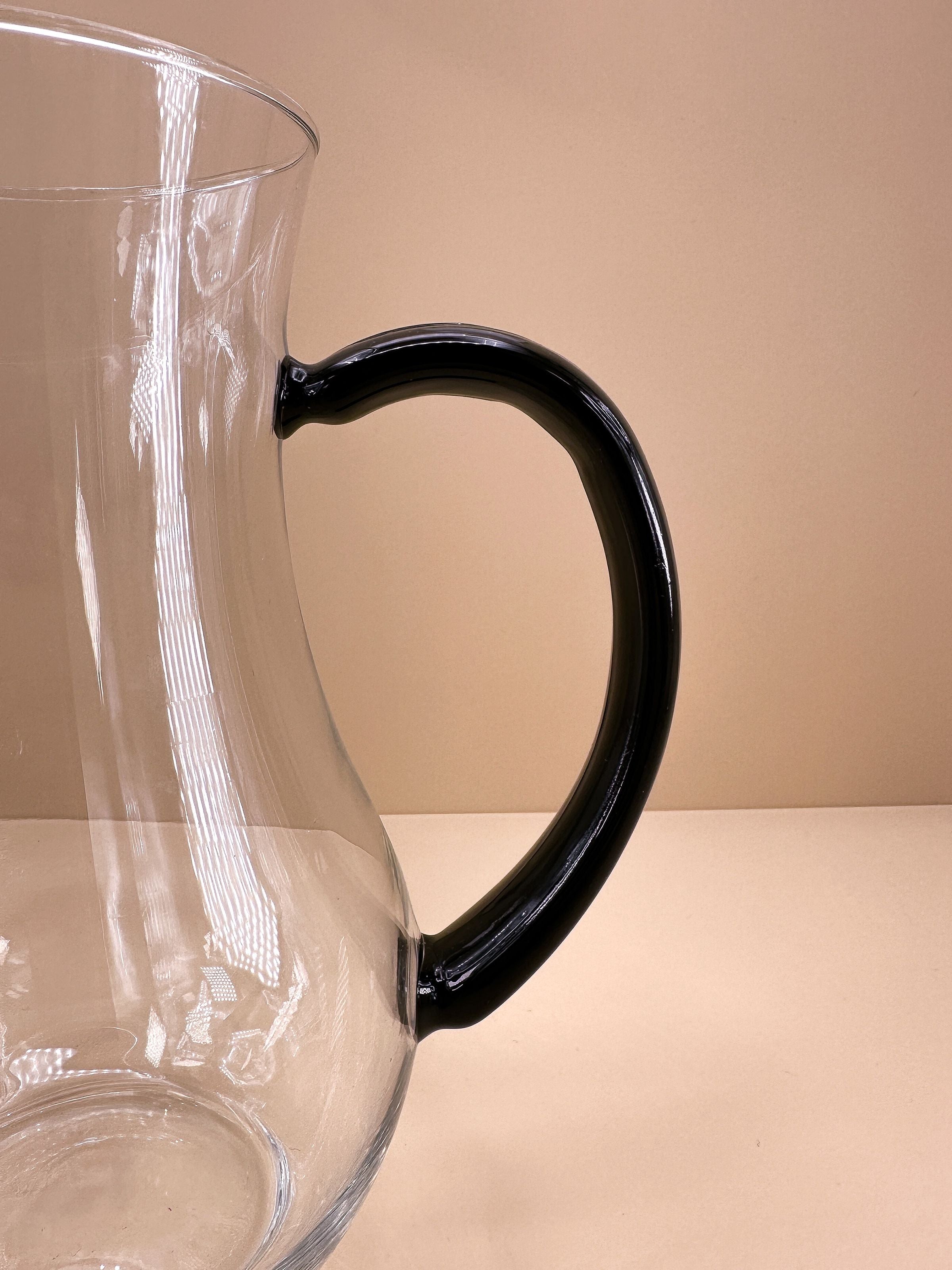 1980s Art Deco Revival carafe — side angle showing black handle detail