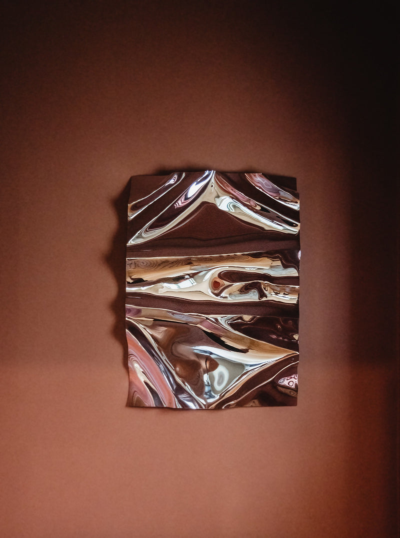 Psychedelic Mirror 75x100cm — close-up of reflective surface against brown wall