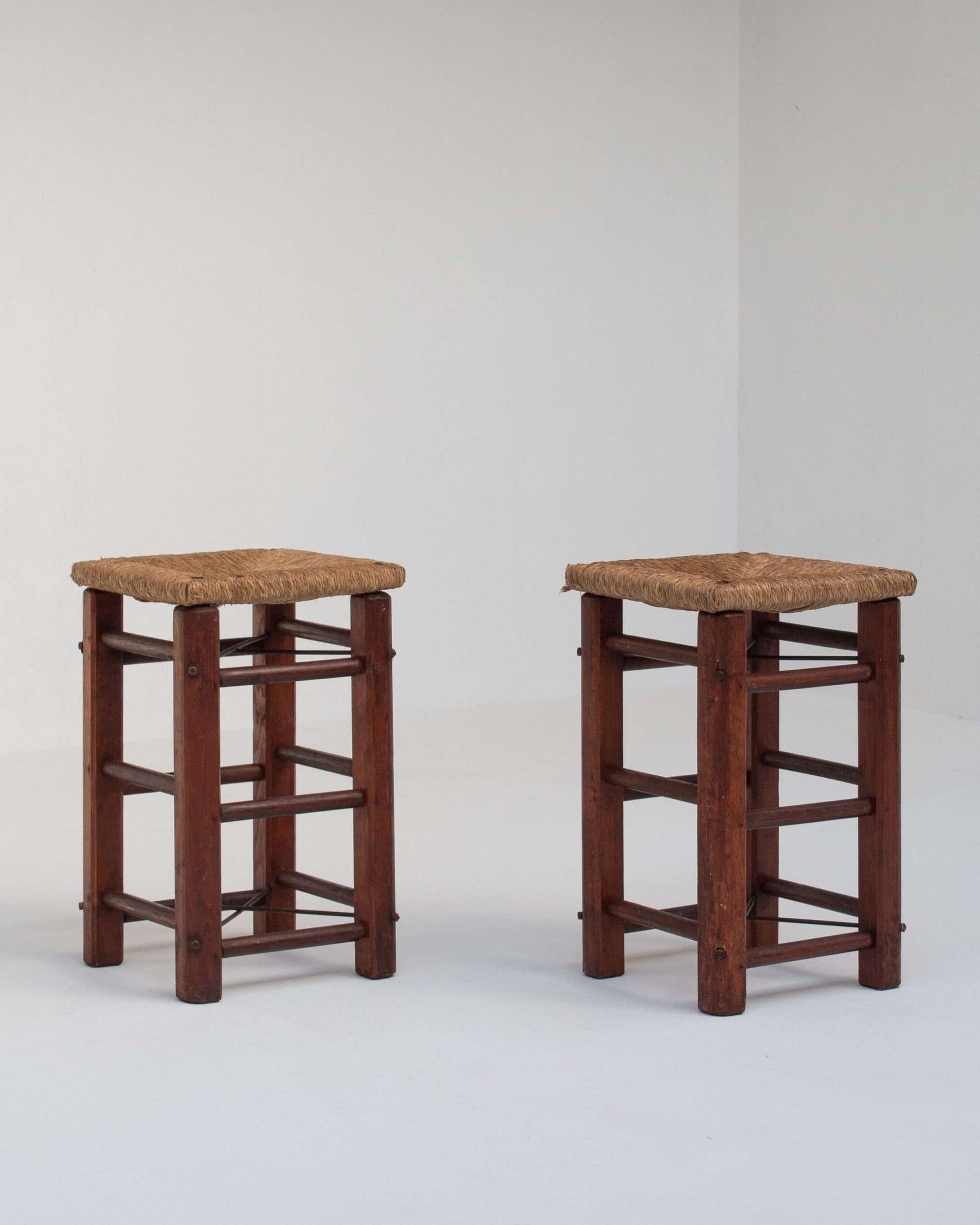 Pair of Rustic Wooden Stools with Woven Rush Seats — close-up of woven rush seats