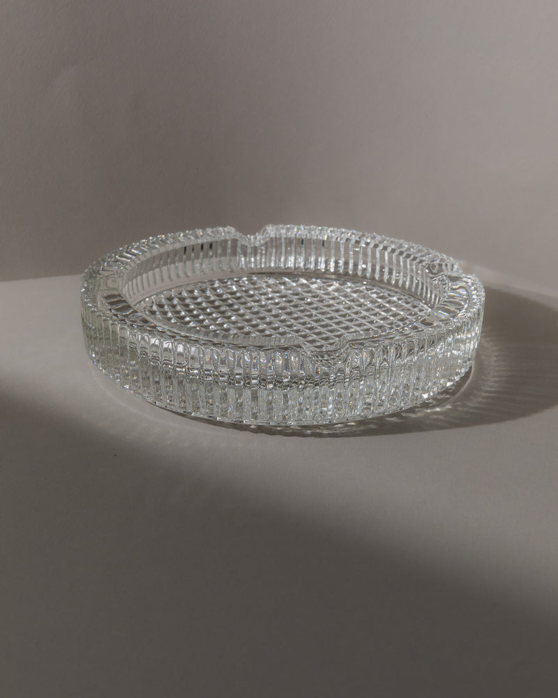 Clear crystal glass ashtray with diamond cut pattern and ridged rim