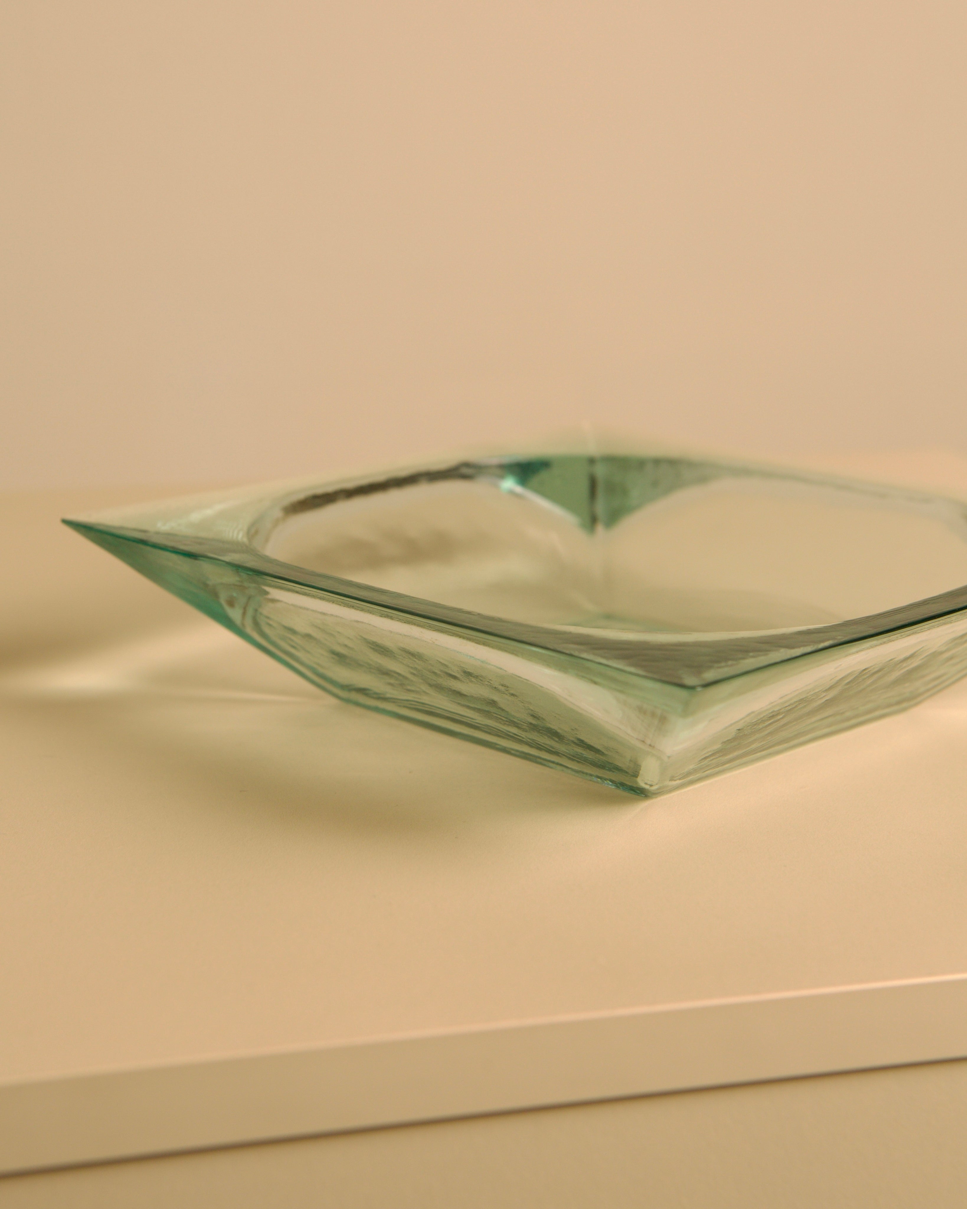 Large Italian glass basket by Fontana Arte — top view on neutral surface