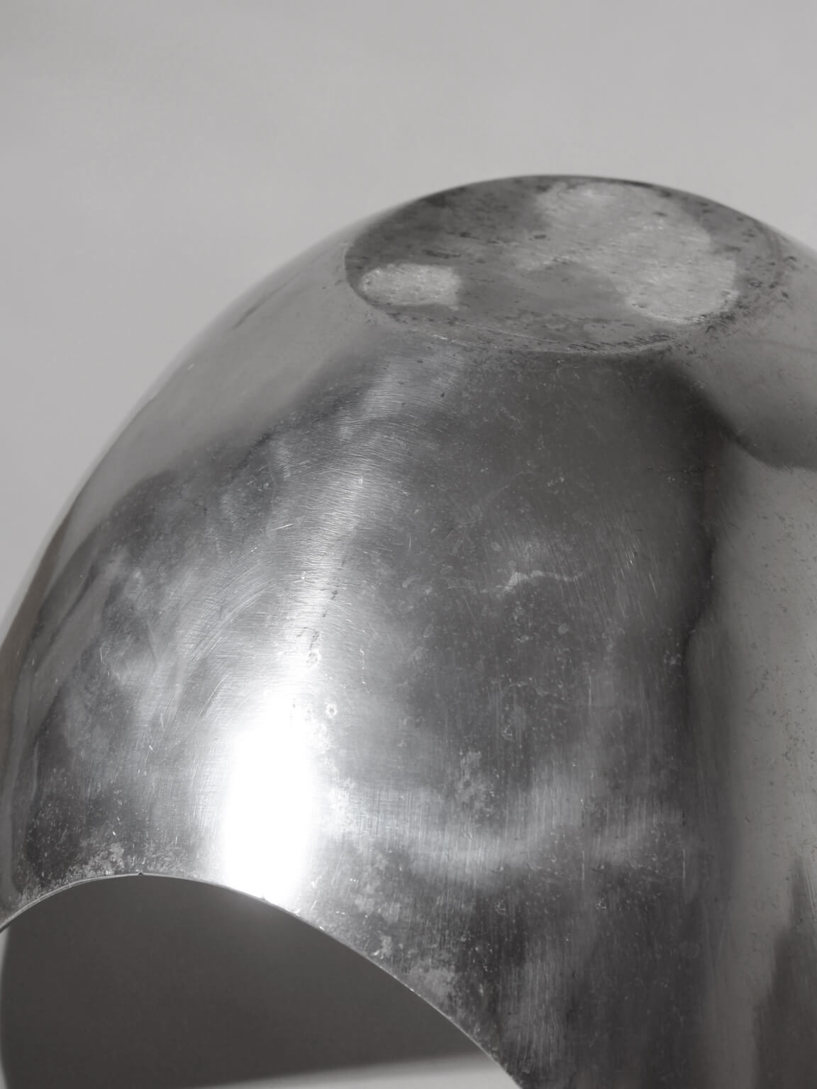 Polished Aluminum Asymmetric Contemporary Large Deep Bowl — close-up of polished aluminum surface