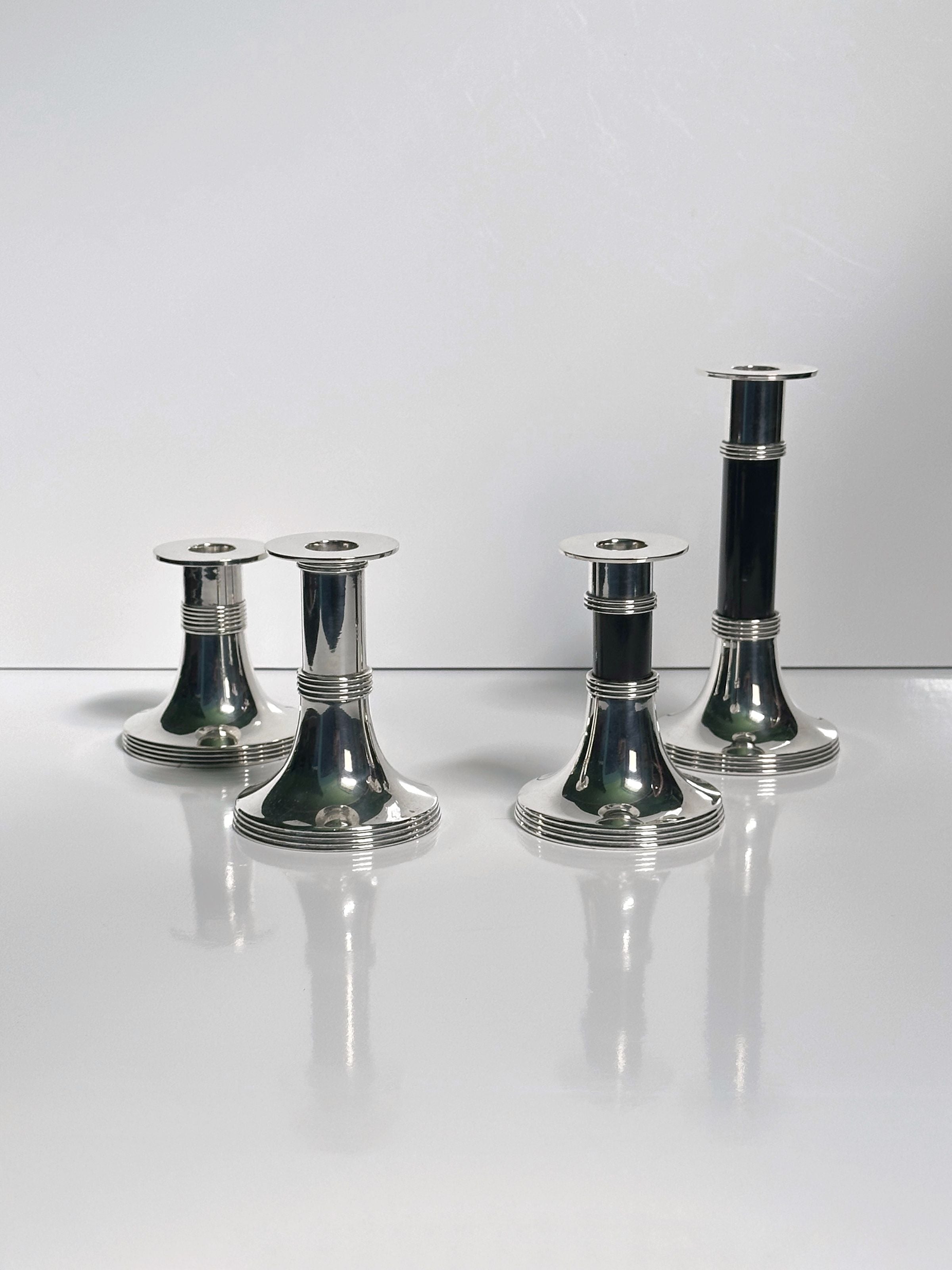 Pair of Silver Plated Candleholders by Gunther Lambert — arranged on reflective surface