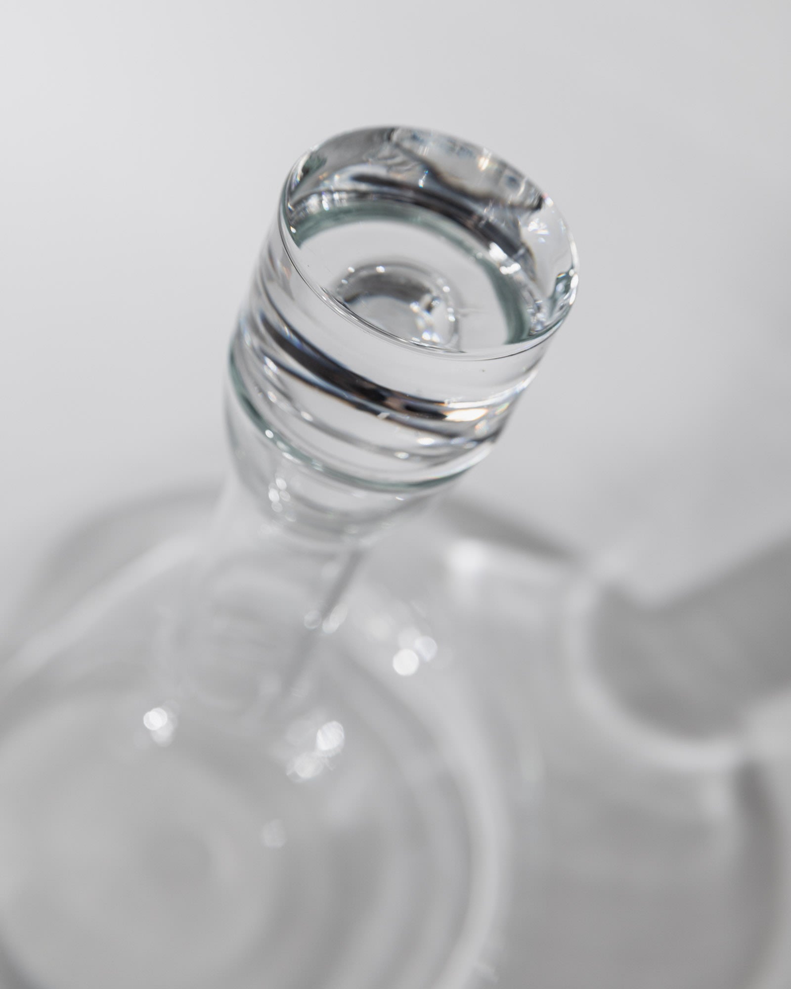 Vintage 1980s Glass Decanter, Italian Glass Ware with Glass Stopper — top view highlighting clear glass stopper