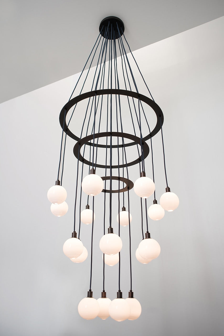 SkLO Drape Circle 18 Chandelier - White Glass, Dark Oxidized finish — lifestyle setting