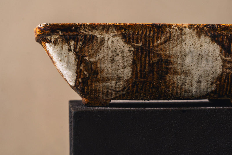 Detail view of 1970s ceramic planter showing decorative pattern
