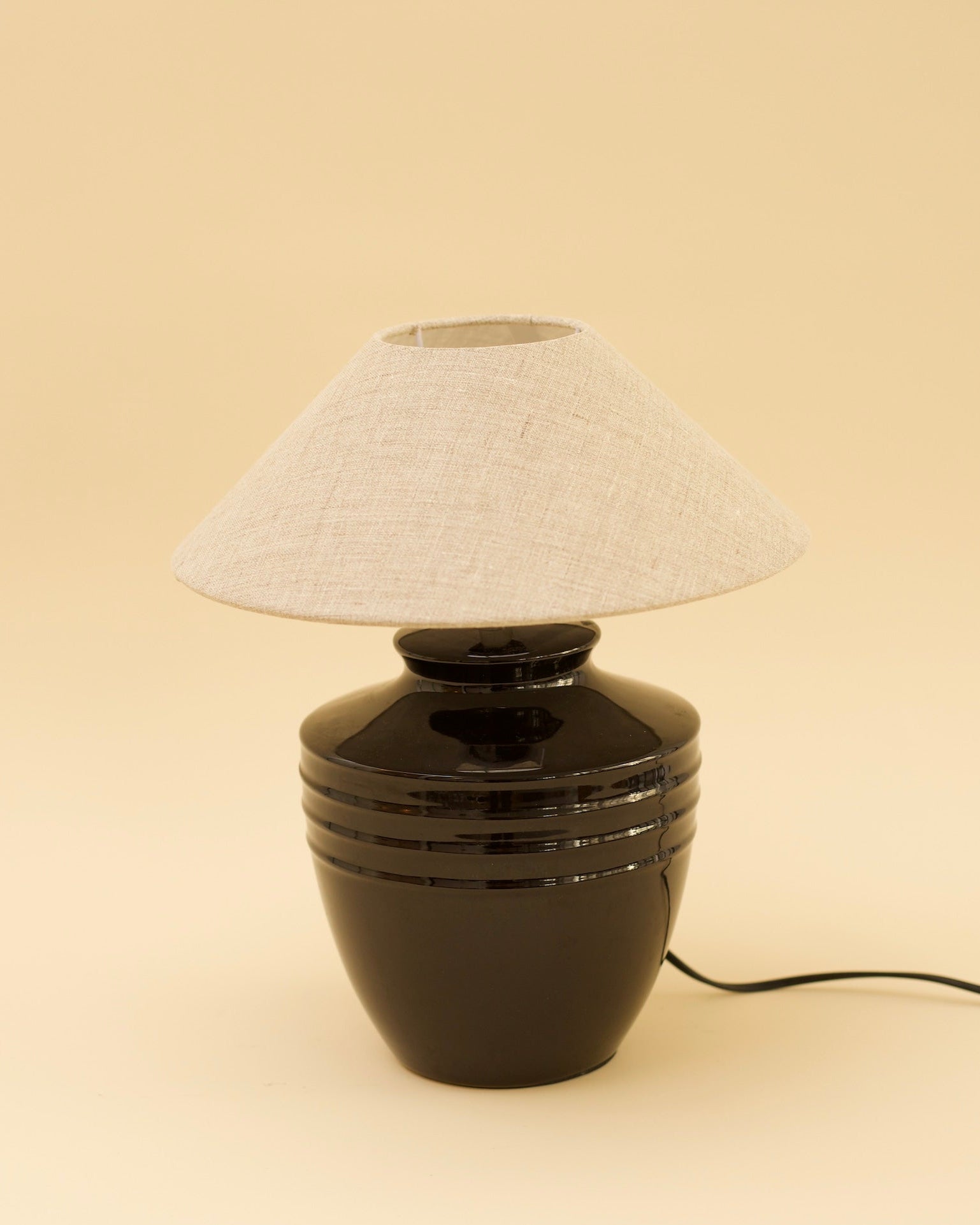 ELME Table Lamp — close-up of black ceramic base with linen shade