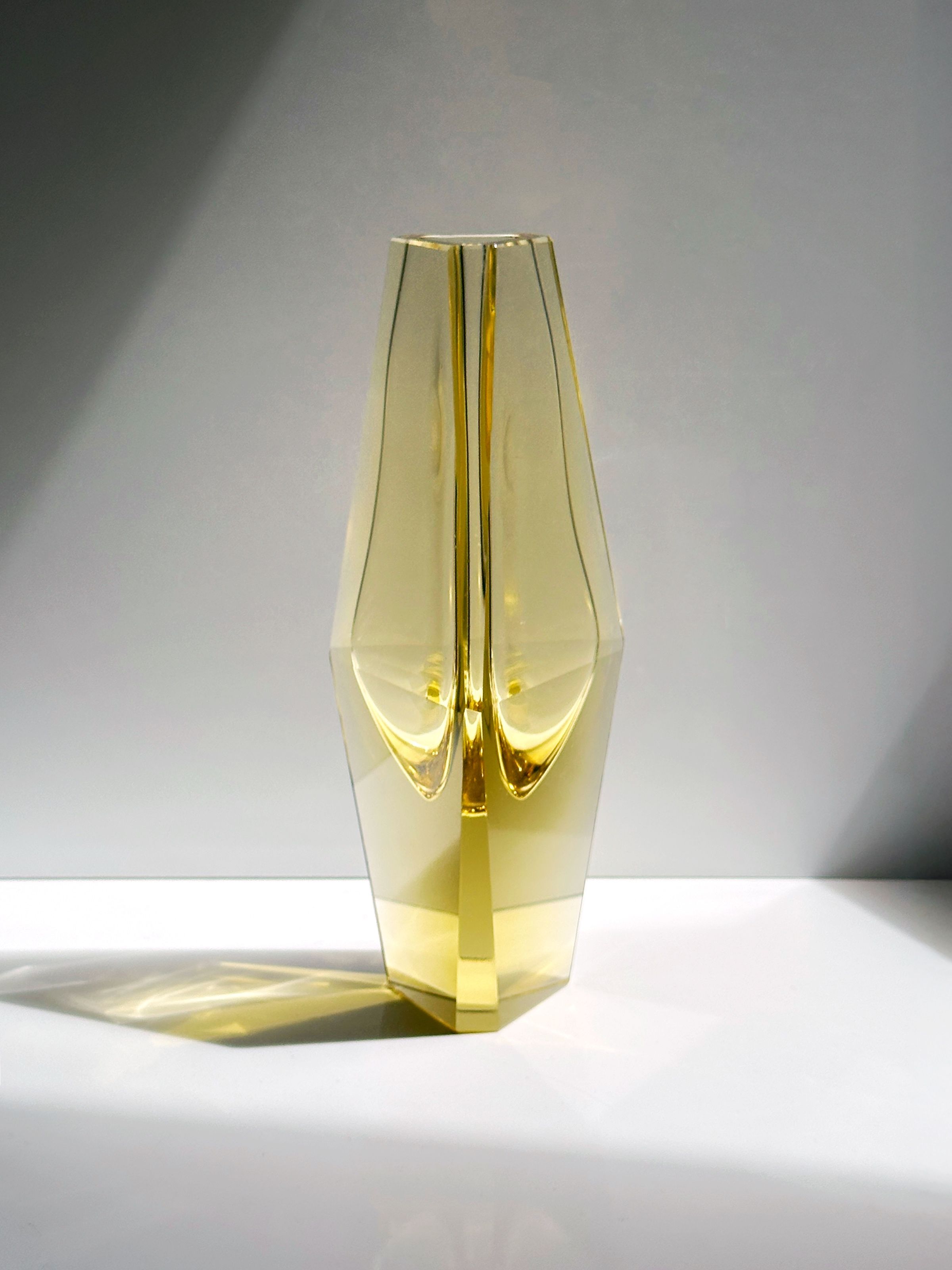 Prismatic citrine Murano glass vase showing internal light refraction
